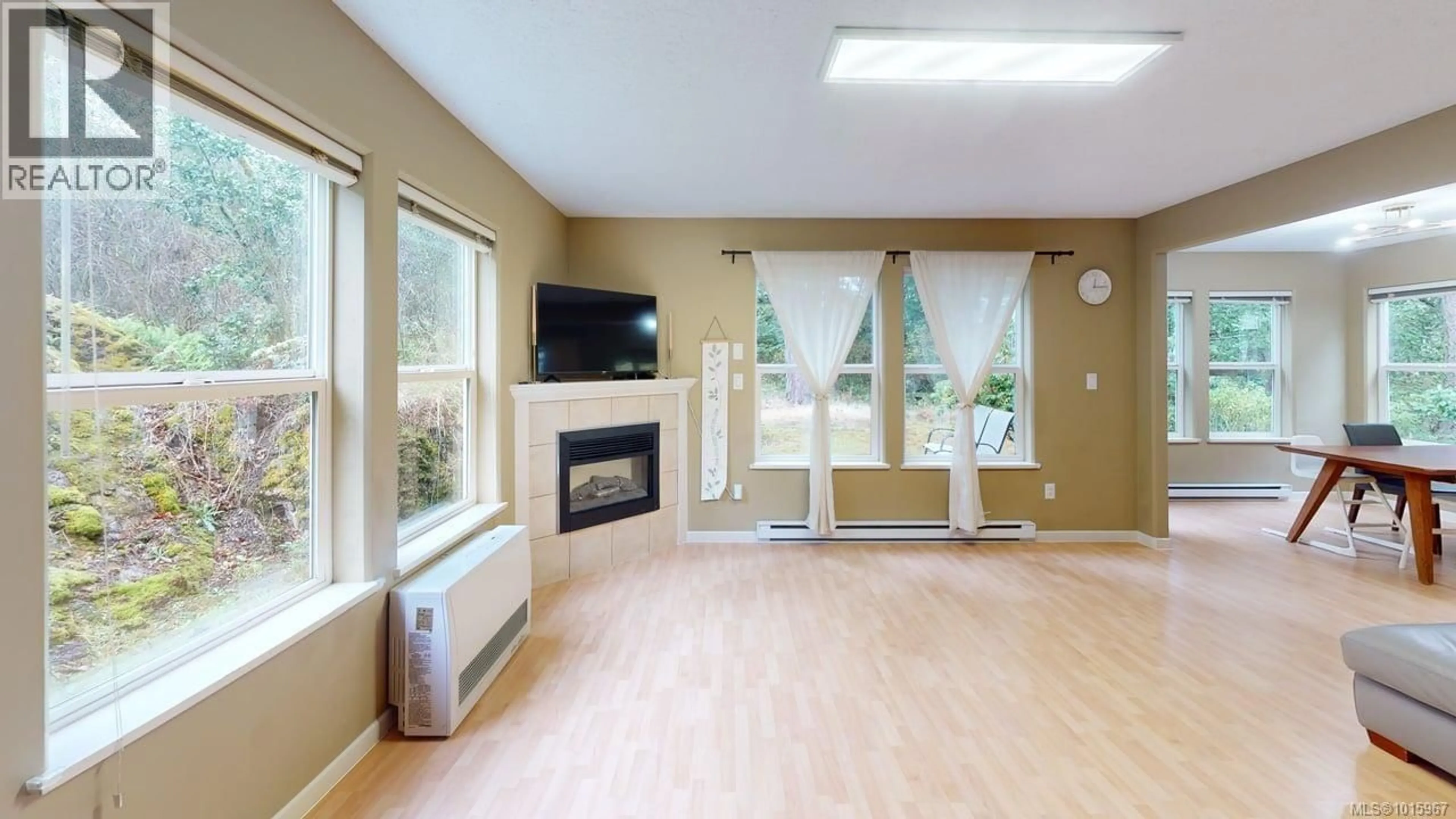 Living room with furniture, wood/laminate floor for 10 - 95 TALCOTT ROAD, View Royal British Columbia V9B6L7