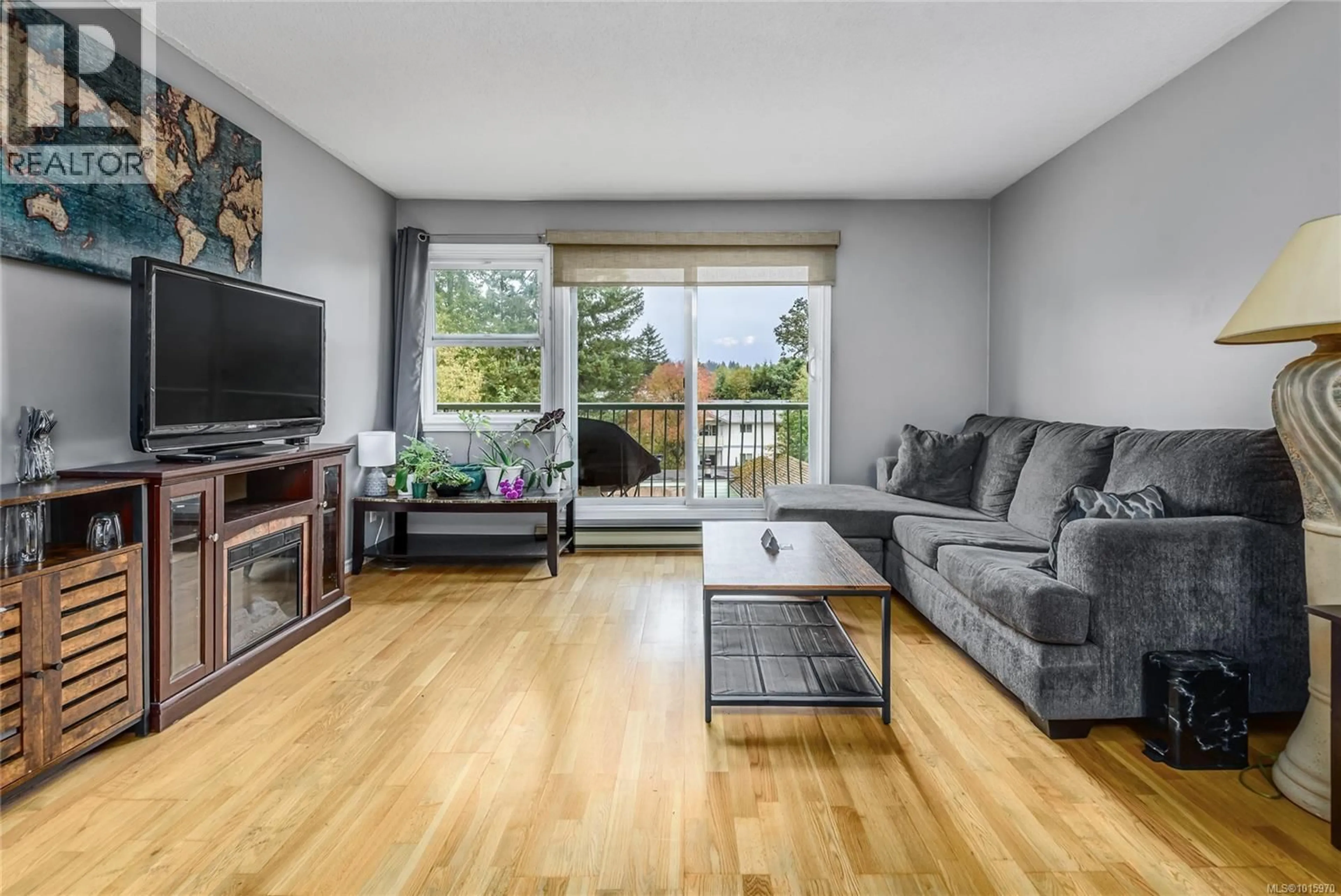 Living room with furniture, wood/laminate floor for 307A - 178 BACK ROAD, Courtenay British Columbia V9N3W6