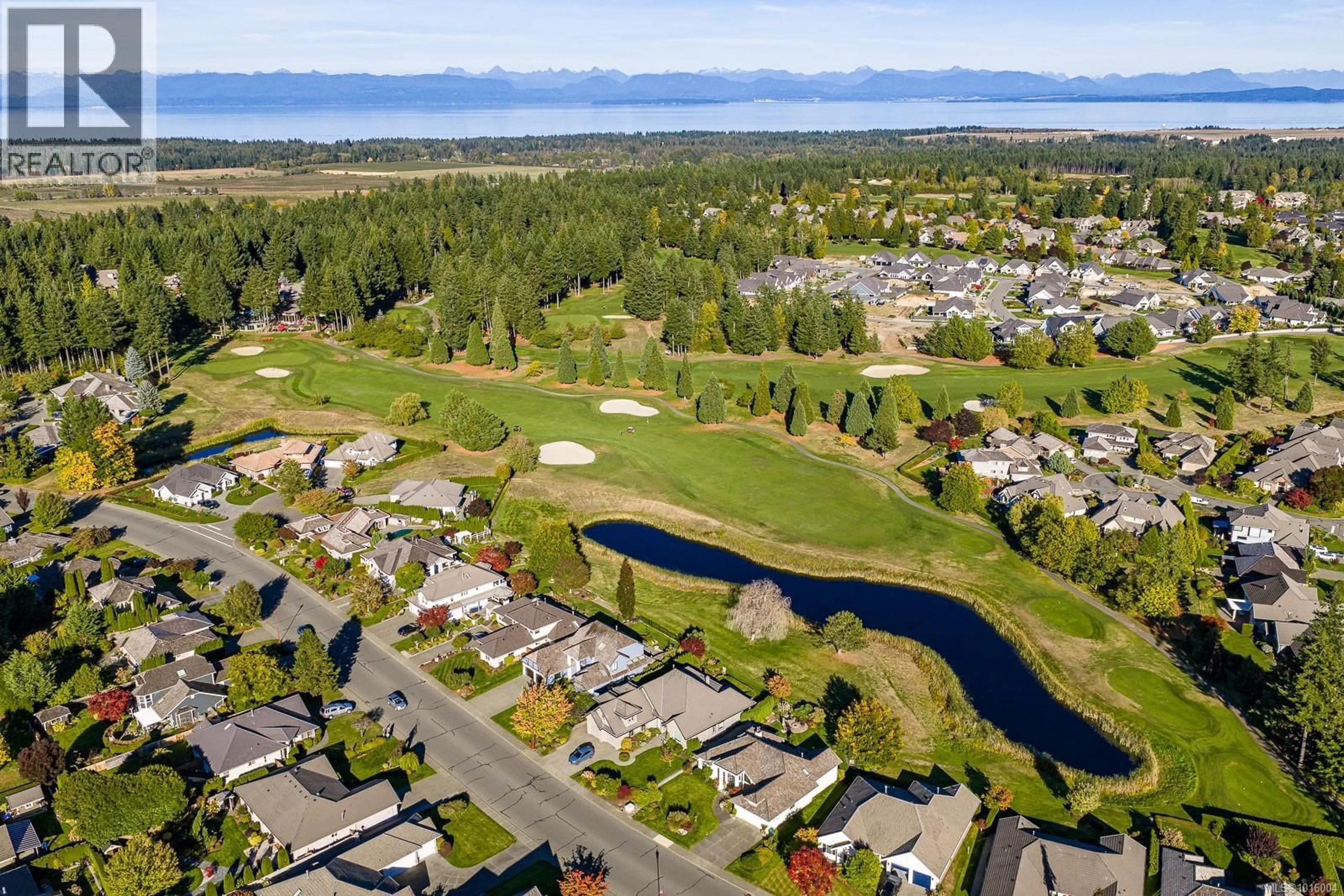 A pic from outside/outdoor area/front of a property/back of a property/a pic from drone, water/lake/river/ocean view for 114 - 1055 CROWN ISLE DRIVE, Courtenay British Columbia V9N0A5