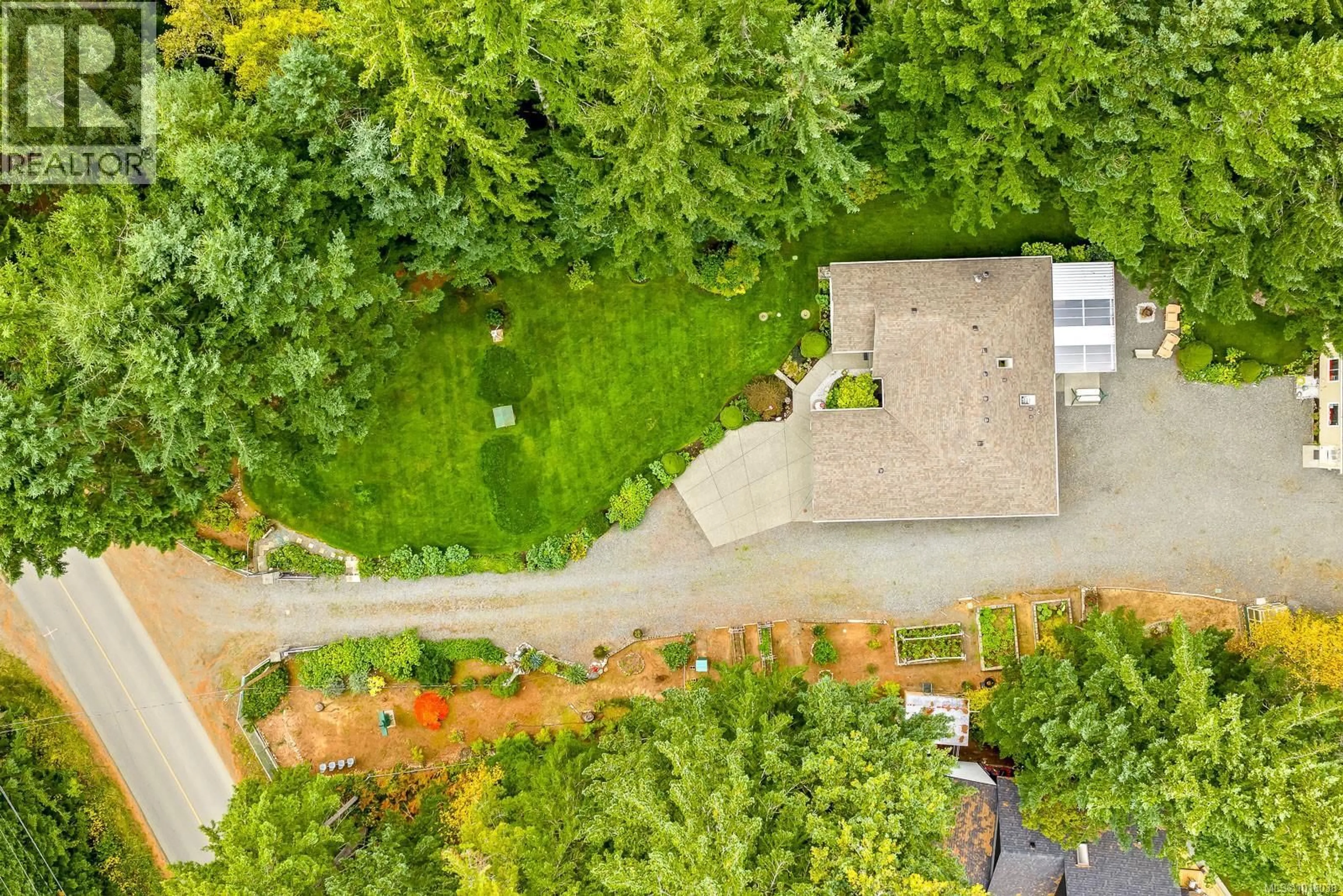 A pic from outside/outdoor area/front of a property/back of a property/a pic from drone, forest/trees view for 1294 WILLIAMS BEACH ROAD, Black Creek British Columbia V0R2M0