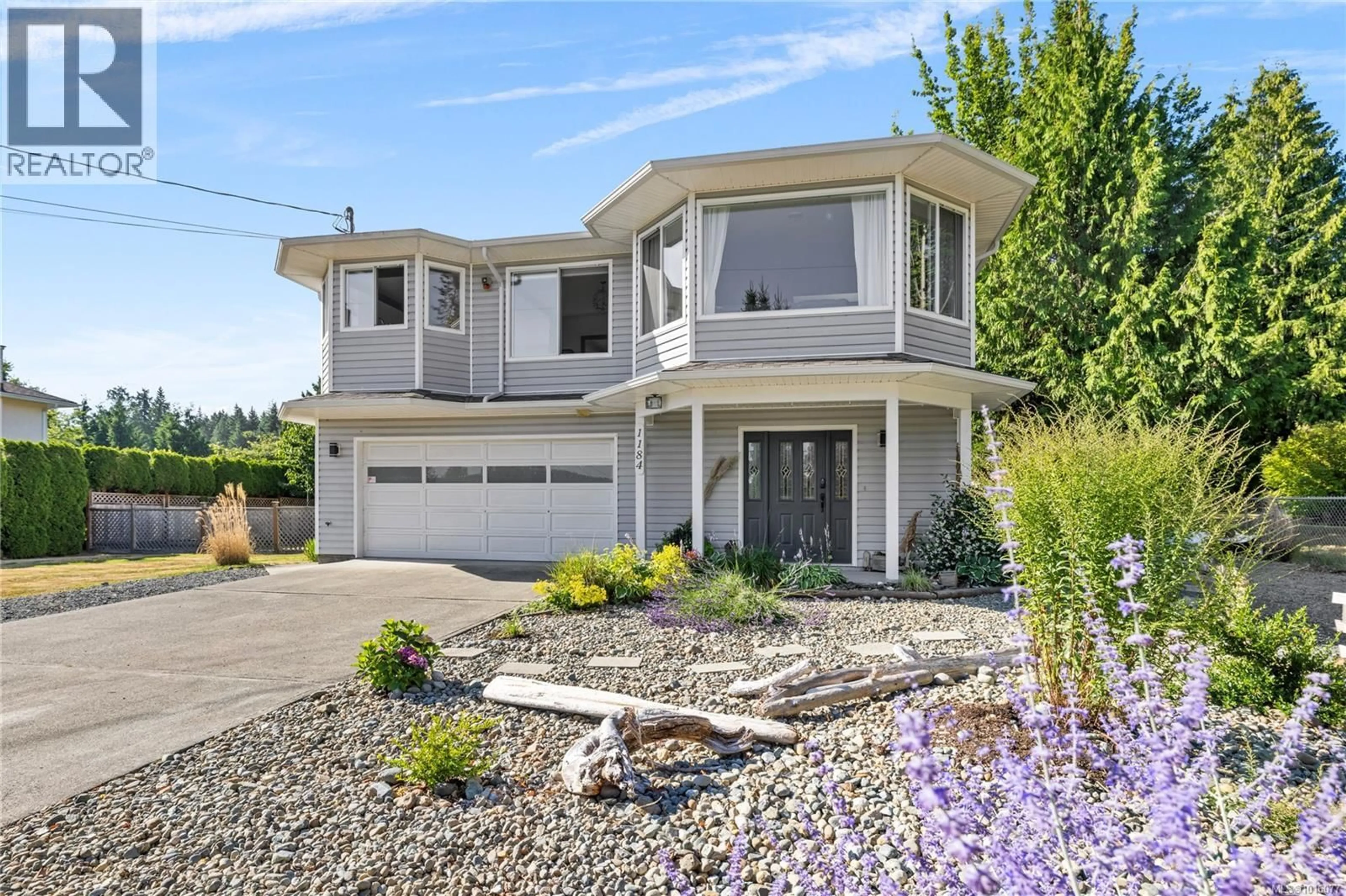 Home with vinyl exterior material, street for 1184 CENTRE ROAD, Qualicum Beach British Columbia V9K2G8