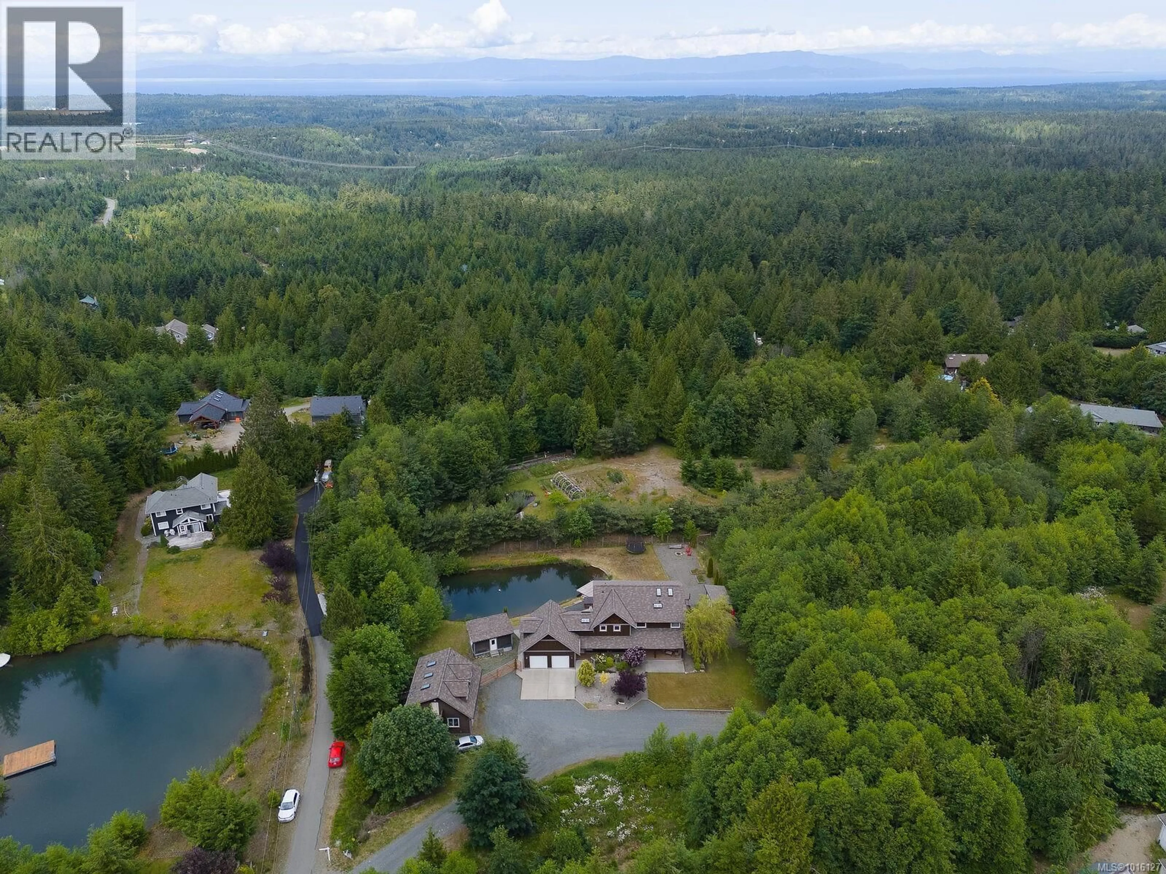 A pic from outside/outdoor area/front of a property/back of a property/a pic from drone, water/lake/river/ocean view for 1655 WYATT'S WAY, Qualicum Beach British Columbia V9K2S3
