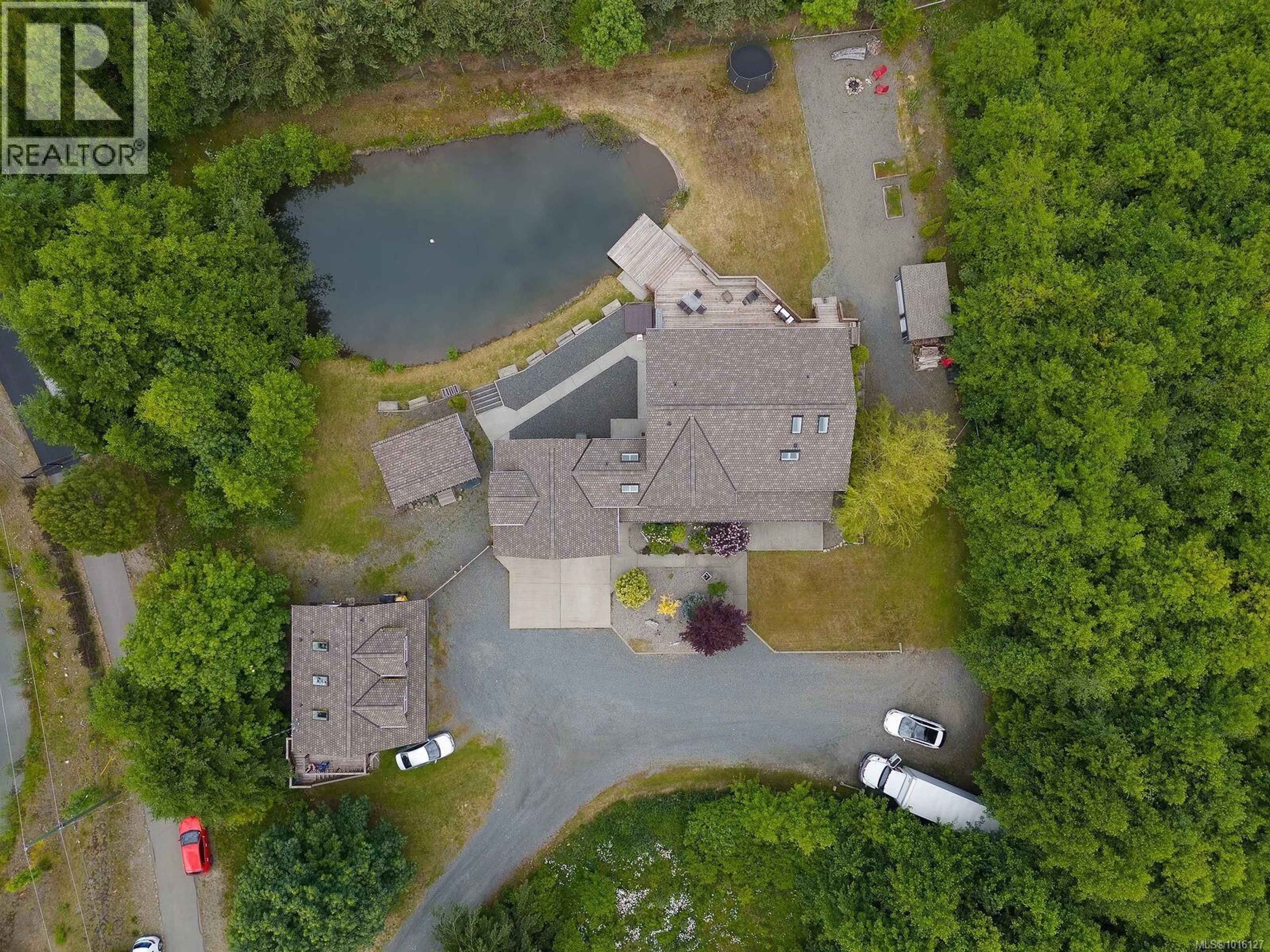 A pic from outside/outdoor area/front of a property/back of a property/a pic from drone, water/lake/river/ocean view for 1655 WYATT'S WAY, Qualicum Beach British Columbia V9K2S3