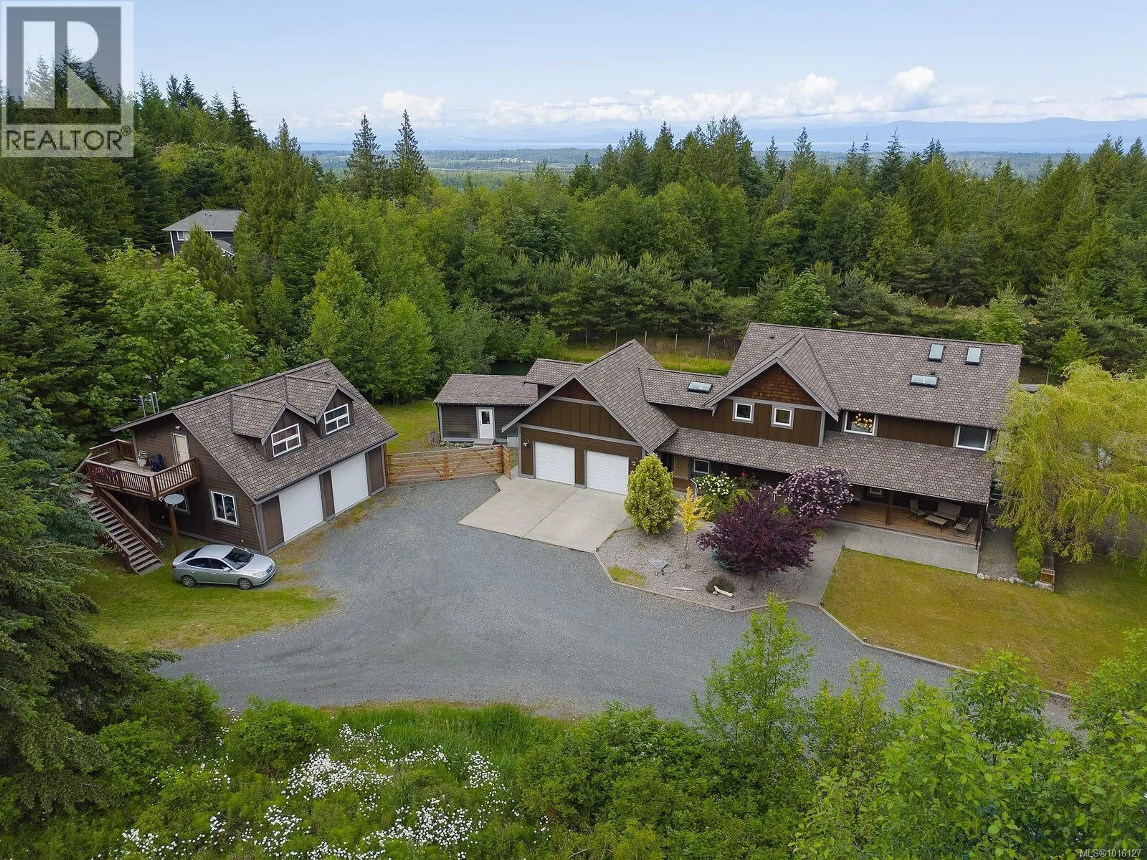 A pic from outside/outdoor area/front of a property/back of a property/a pic from drone, mountain view for 1655 WYATT'S WAY, Qualicum Beach British Columbia V9K2S3