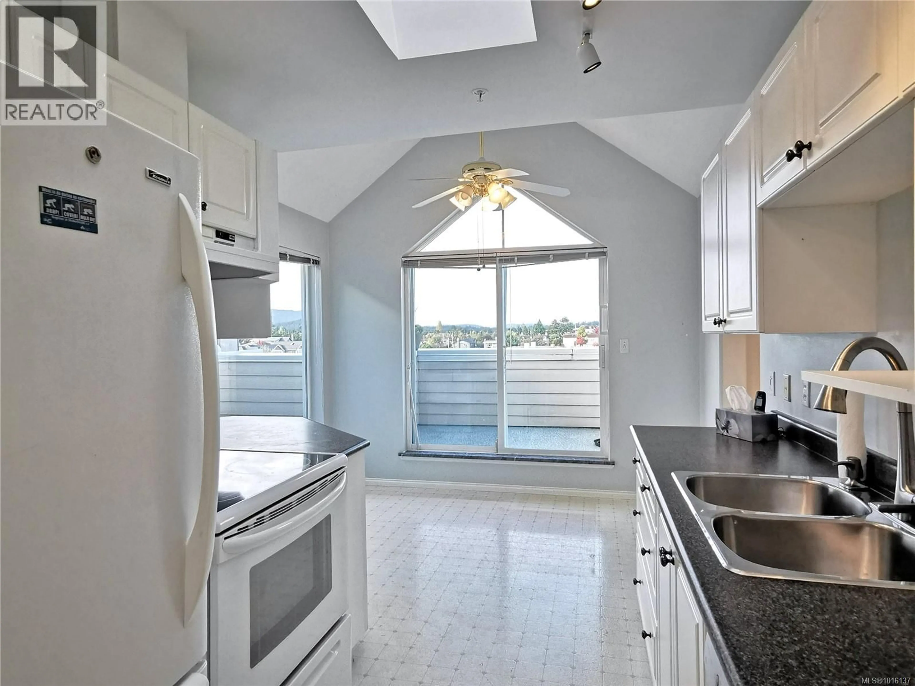 Open concept kitchen, ceramic/tile floor for 403 - 2250 JAMES WHITE BOULEVARD, Sidney British Columbia V8L1Z4