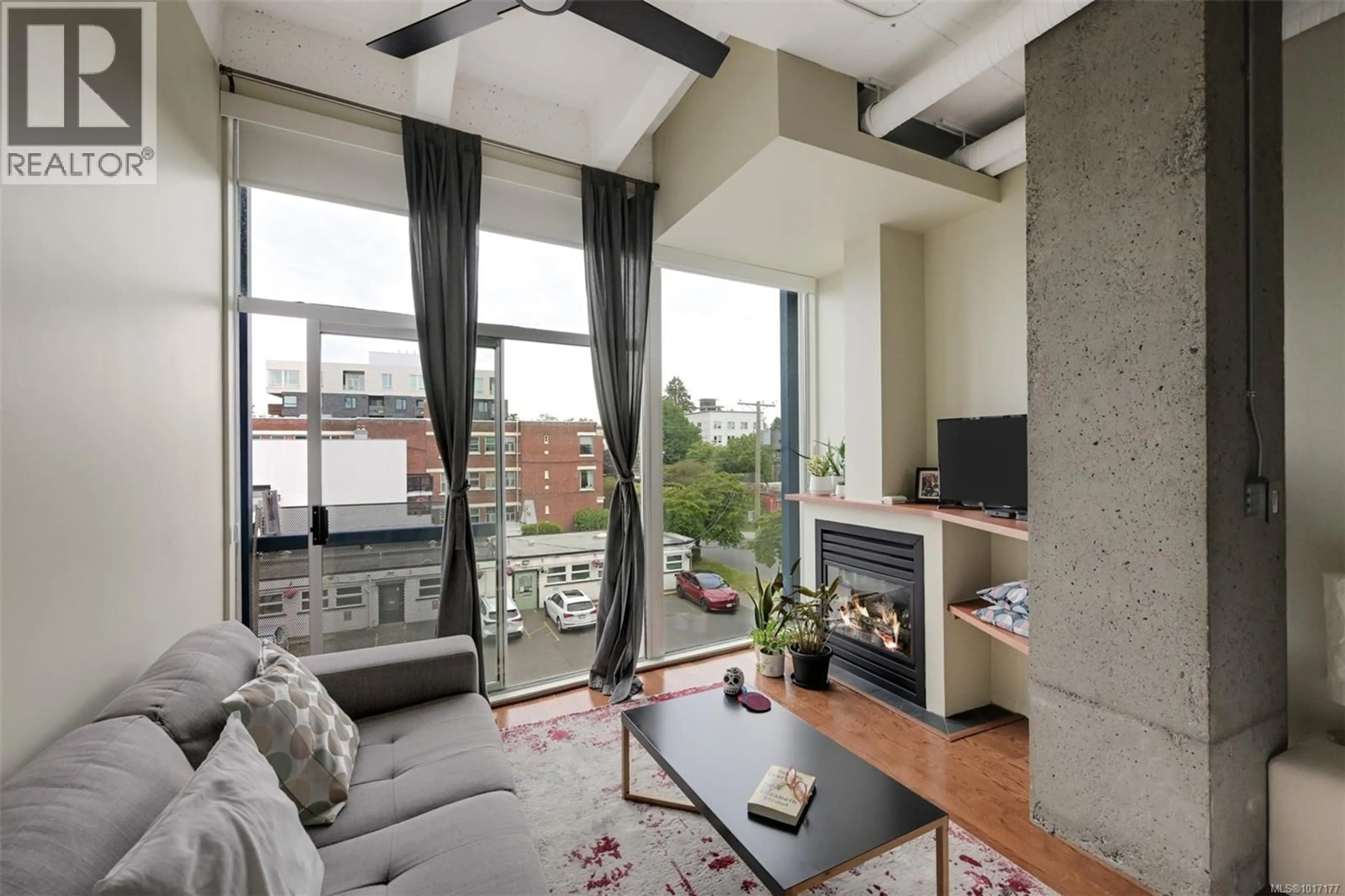 Living room with furniture, cement floor for 305 - 1061 FORT STREET, Victoria British Columbia V8V5A1