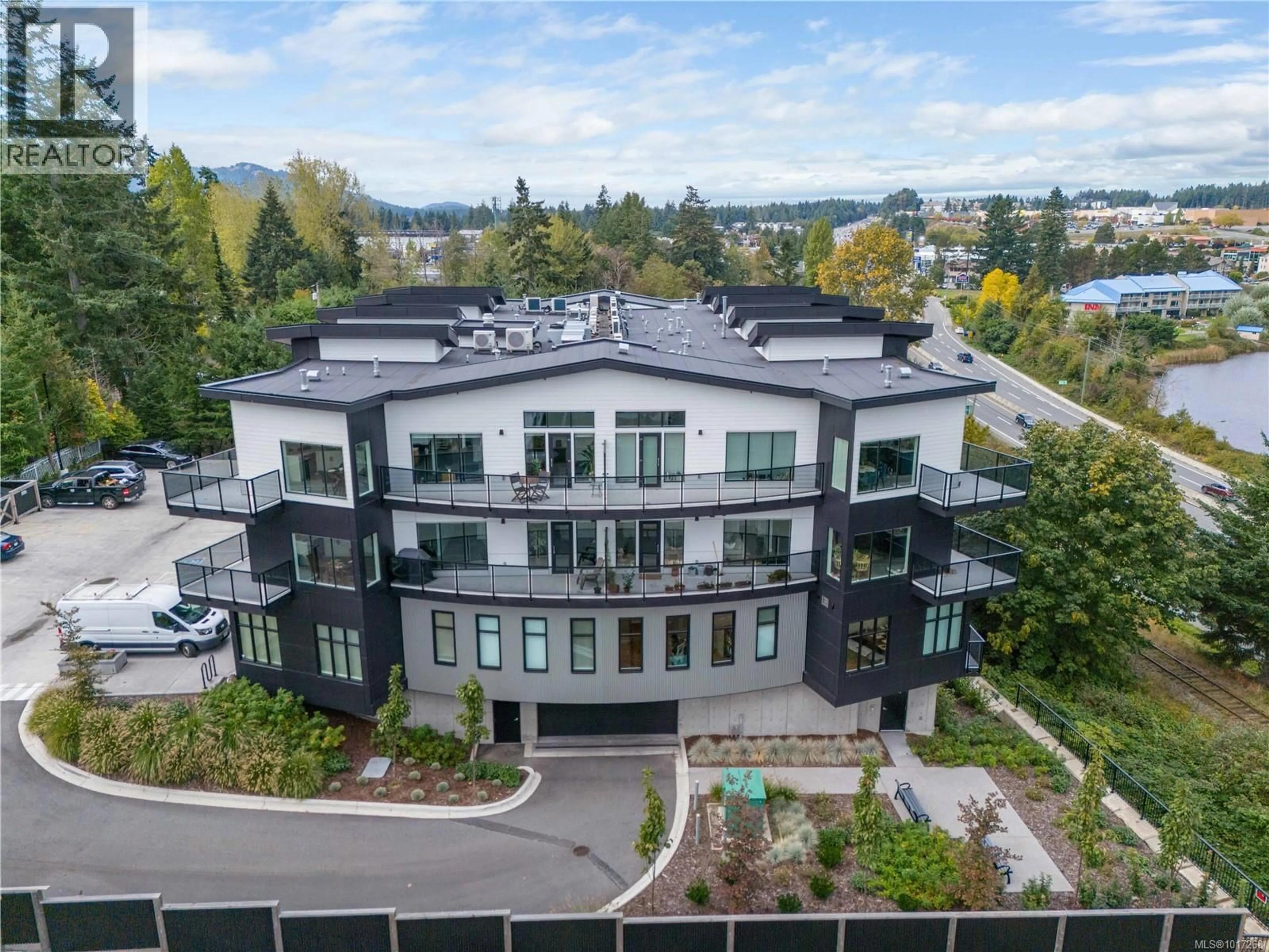 A pic from outside/outdoor area/front of a property/back of a property/a pic from drone, mountain view for 206 - 4474 WELLINGTON ROAD, Nanaimo British Columbia V9T2H3