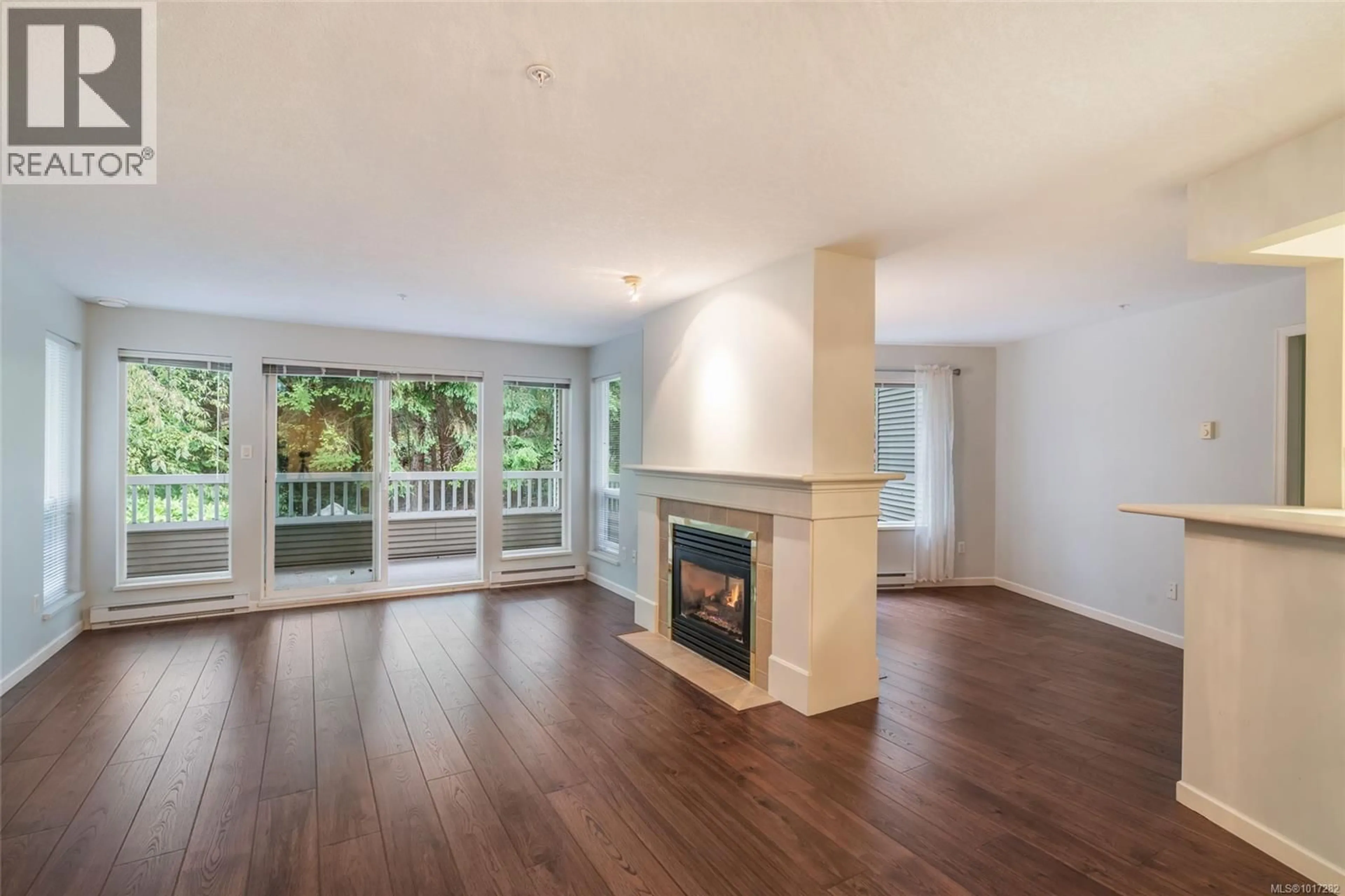 Living room with furniture, wood/laminate floor for 209 - 5620 EDGEWATER LANE, Nanaimo British Columbia V9T6K1