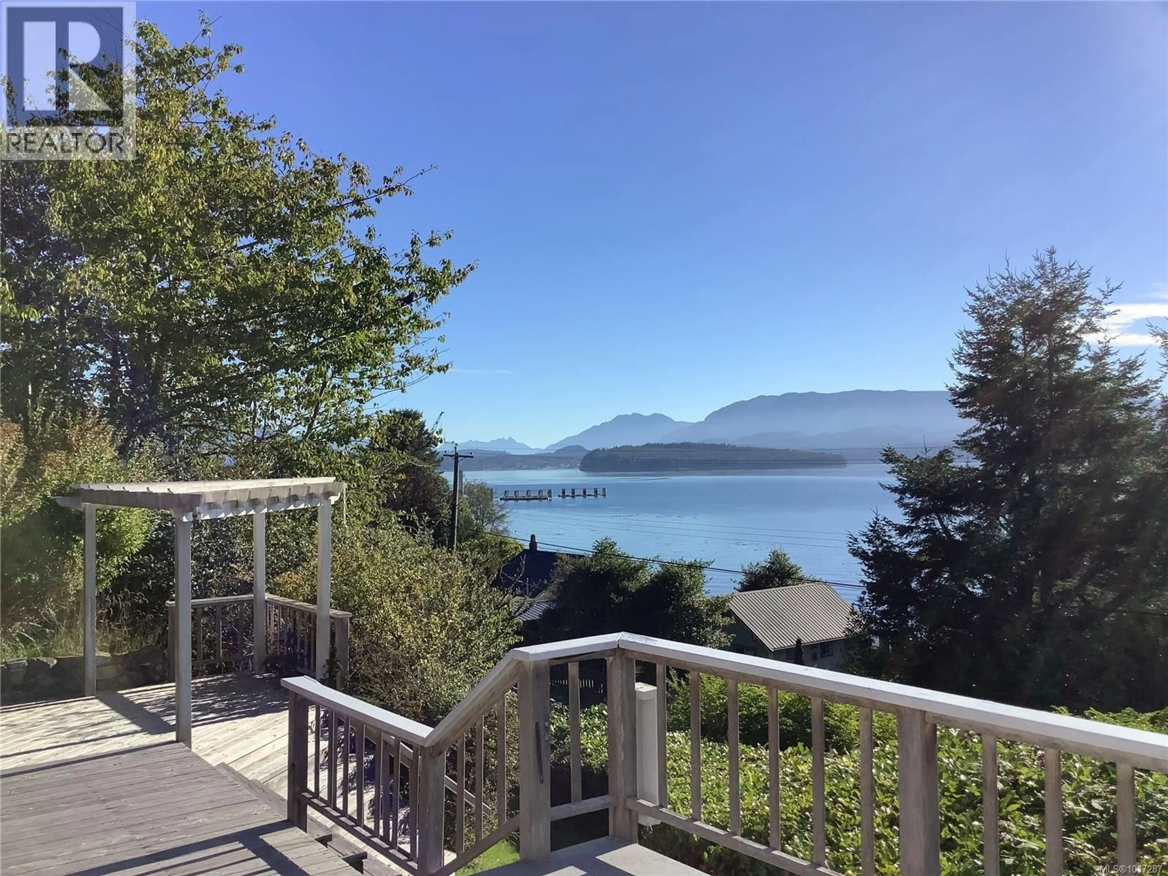 A pic from outside/outdoor area/front of a property/back of a property/a pic from drone, water/lake/river/ocean view for 110 10TH AVENUE, Sointula British Columbia V0N3E0