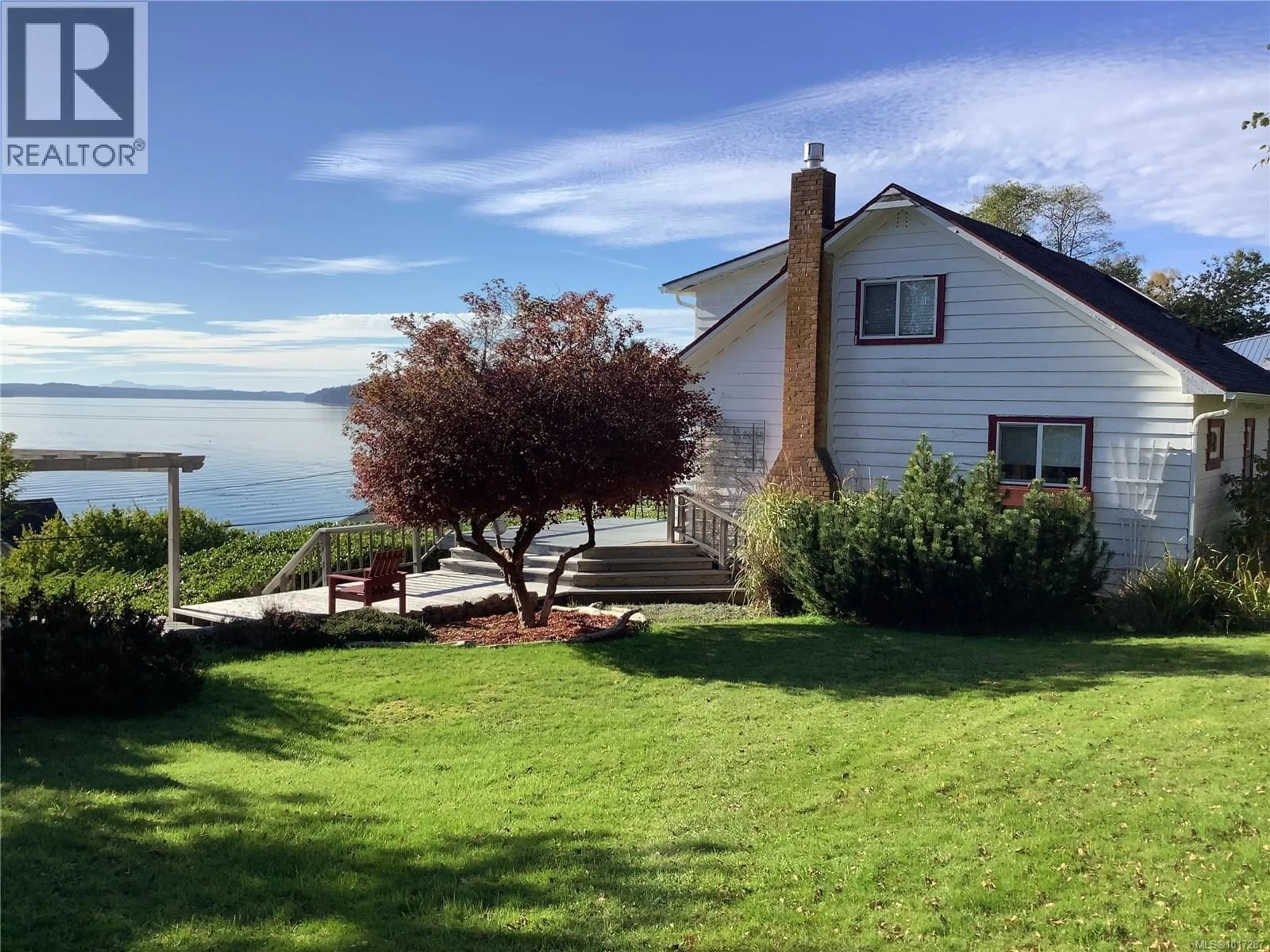 A pic from outside/outdoor area/front of a property/back of a property/a pic from drone, water/lake/river/ocean view for 110 10TH AVENUE, Sointula British Columbia V0N3E0