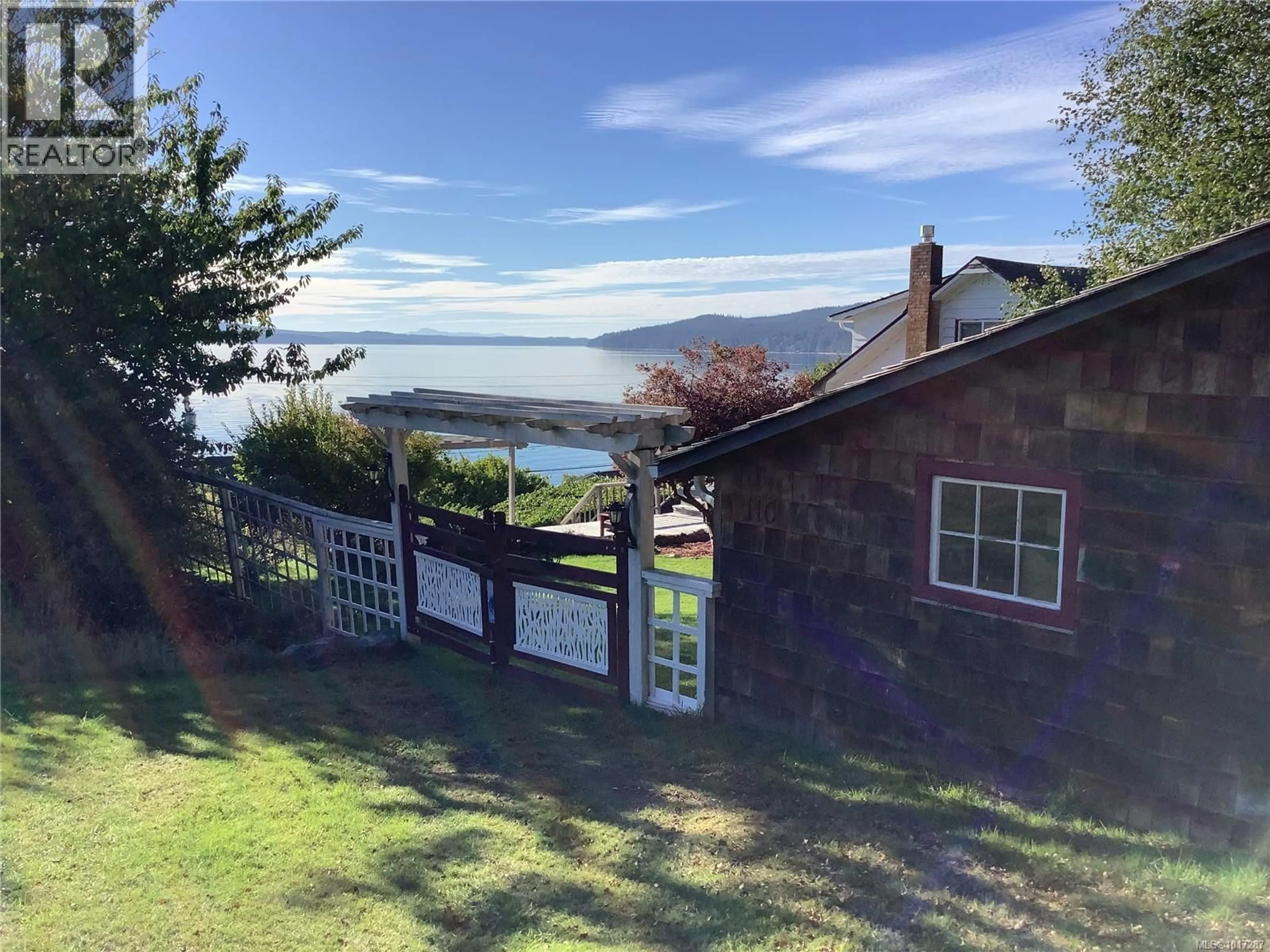 A pic from outside/outdoor area/front of a property/back of a property/a pic from drone, water/lake/river/ocean view for 110 10TH AVENUE, Sointula British Columbia V0N3E0
