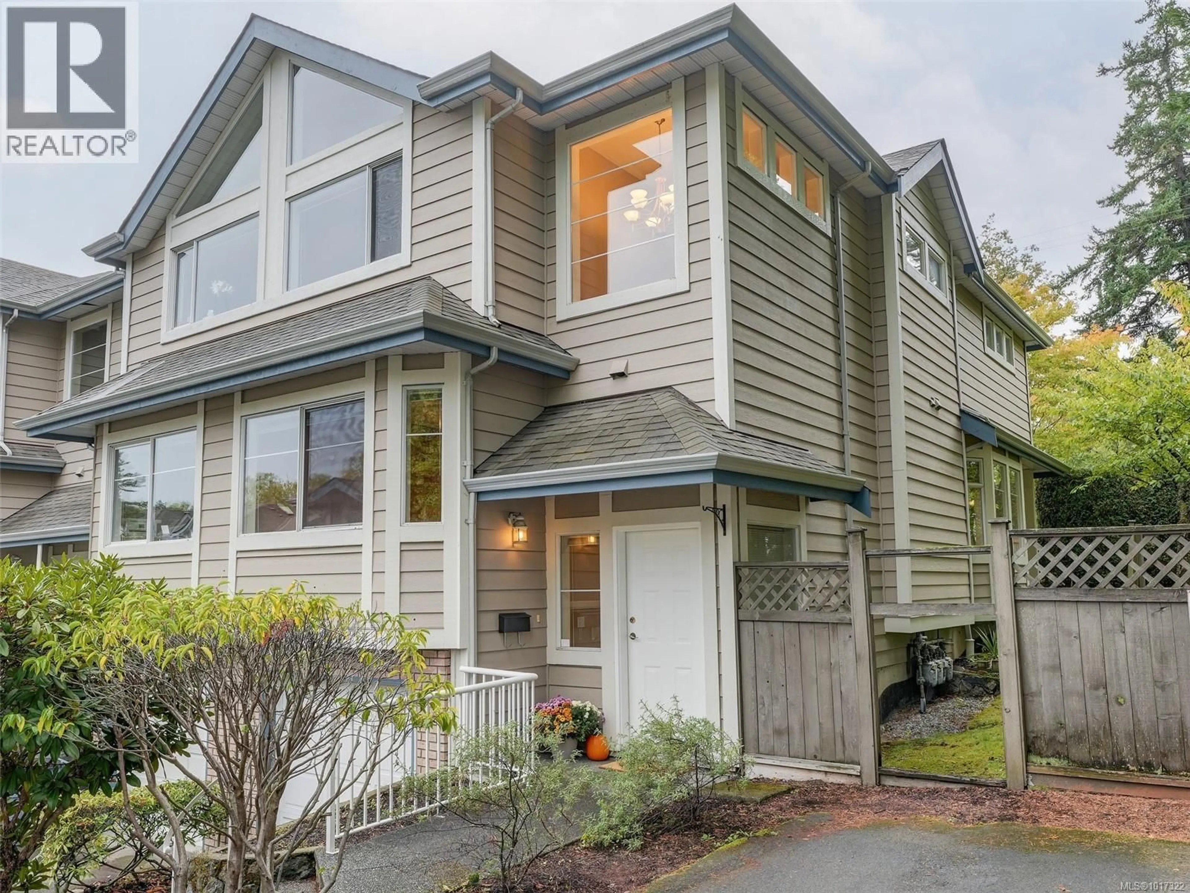 Home with vinyl exterior material, street for 1 - 4619 ELK LAKE DRIVE, Saanich British Columbia V8Z5M2