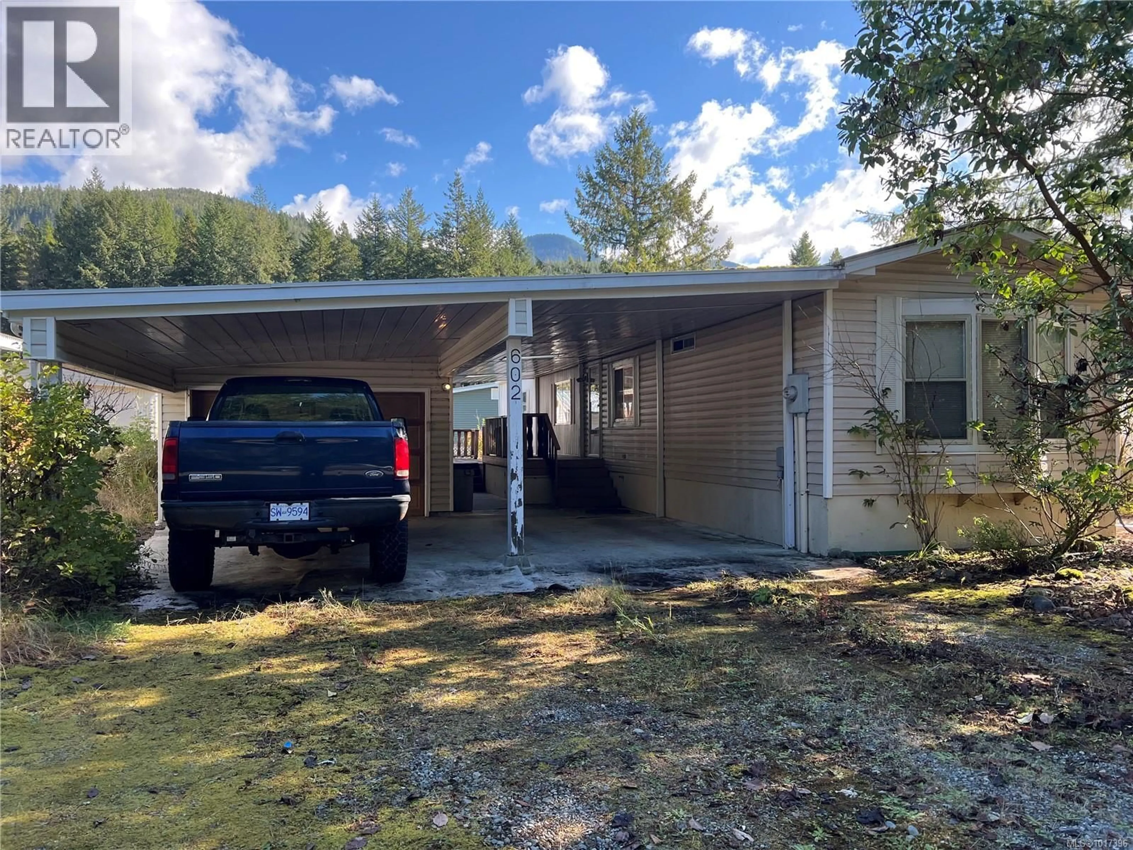 Home with vinyl exterior material, street for 602 MATCHLEE DRIVE, Gold River British Columbia V0P1G0