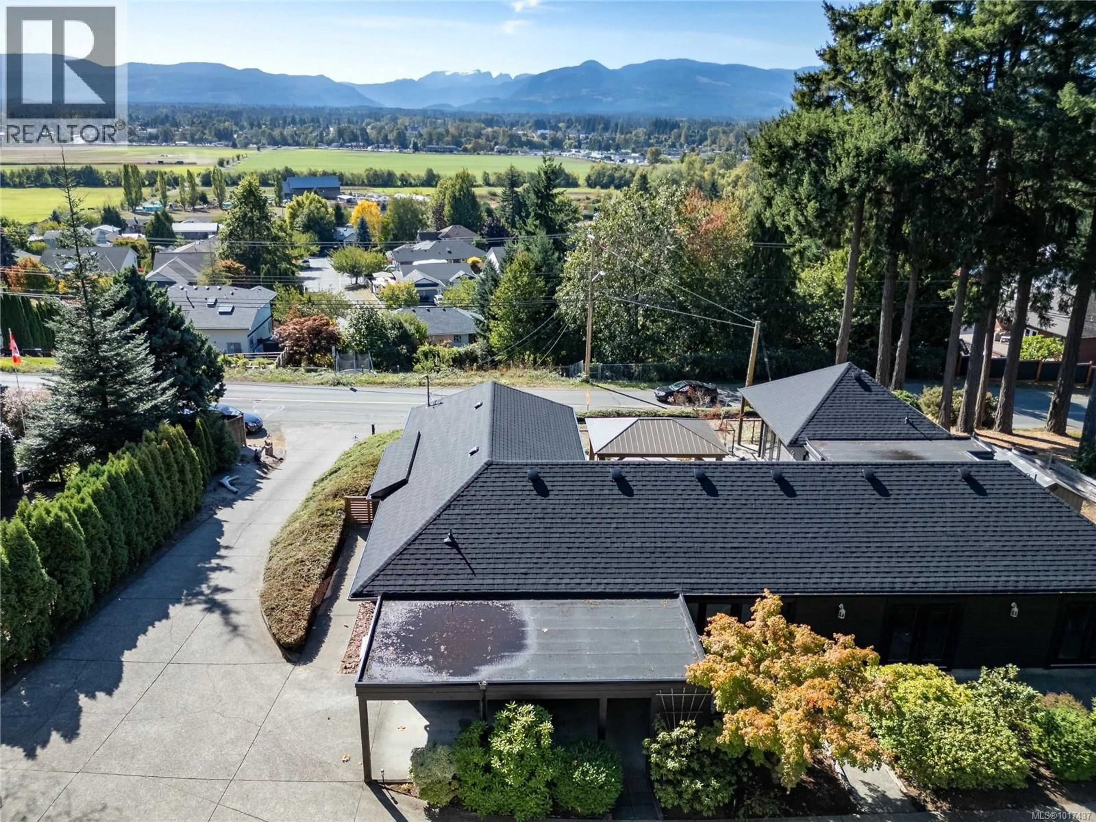 A pic from outside/outdoor area/front of a property/back of a property/a pic from drone, mountain view for 1100 BACK ROAD, Courtenay British Columbia V9N8M7
