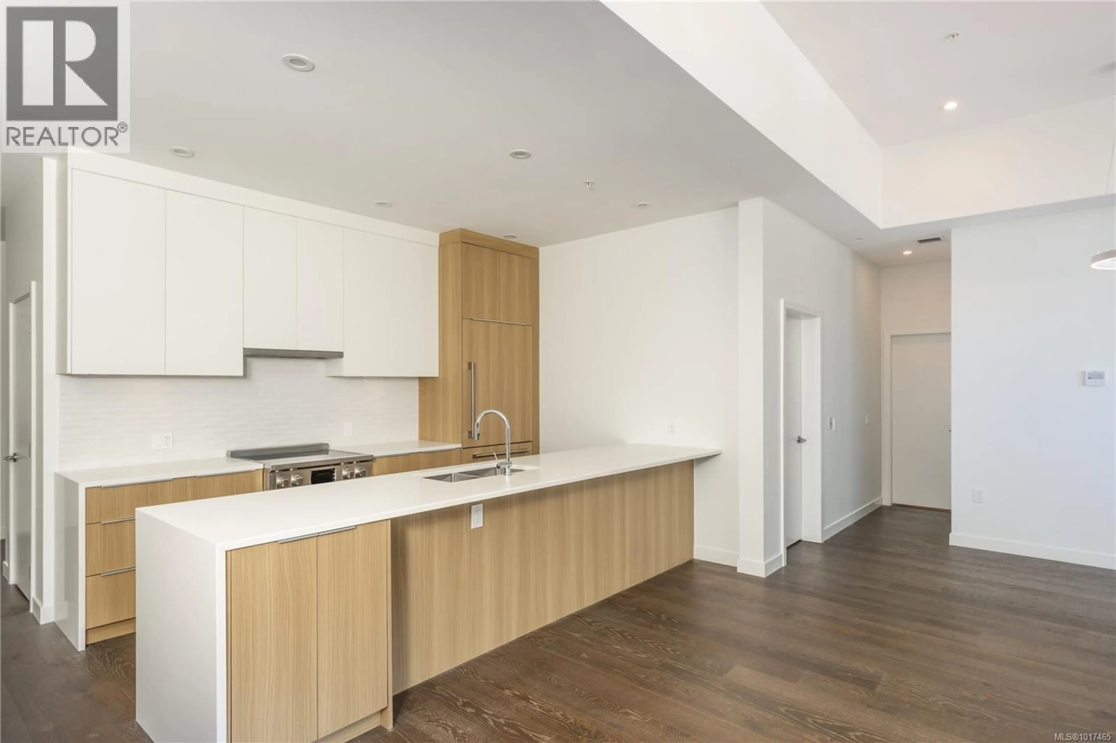 Open concept kitchen, wood/laminate floor for 407 - 9570 FIFTH STREET, Sidney British Columbia V8L2W5
