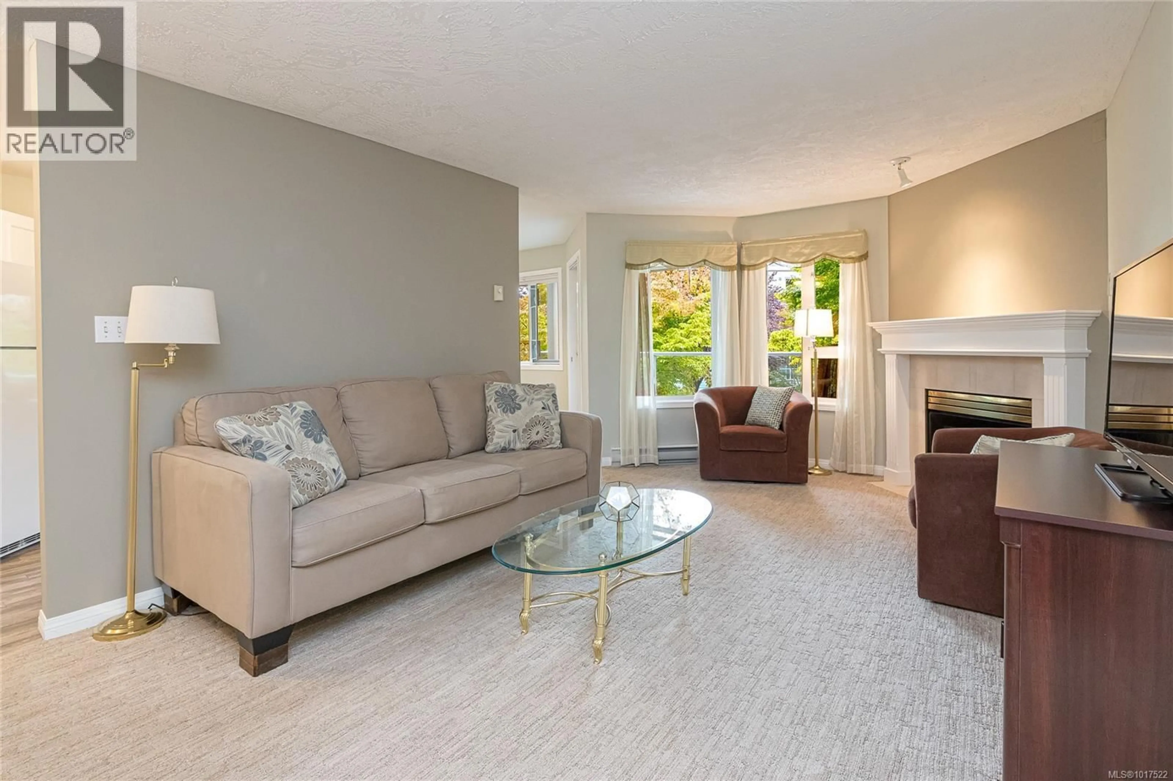 Living room with furniture, unknown for 211 - 490 MARSETT PLACE, Saanich British Columbia V8Z7J1