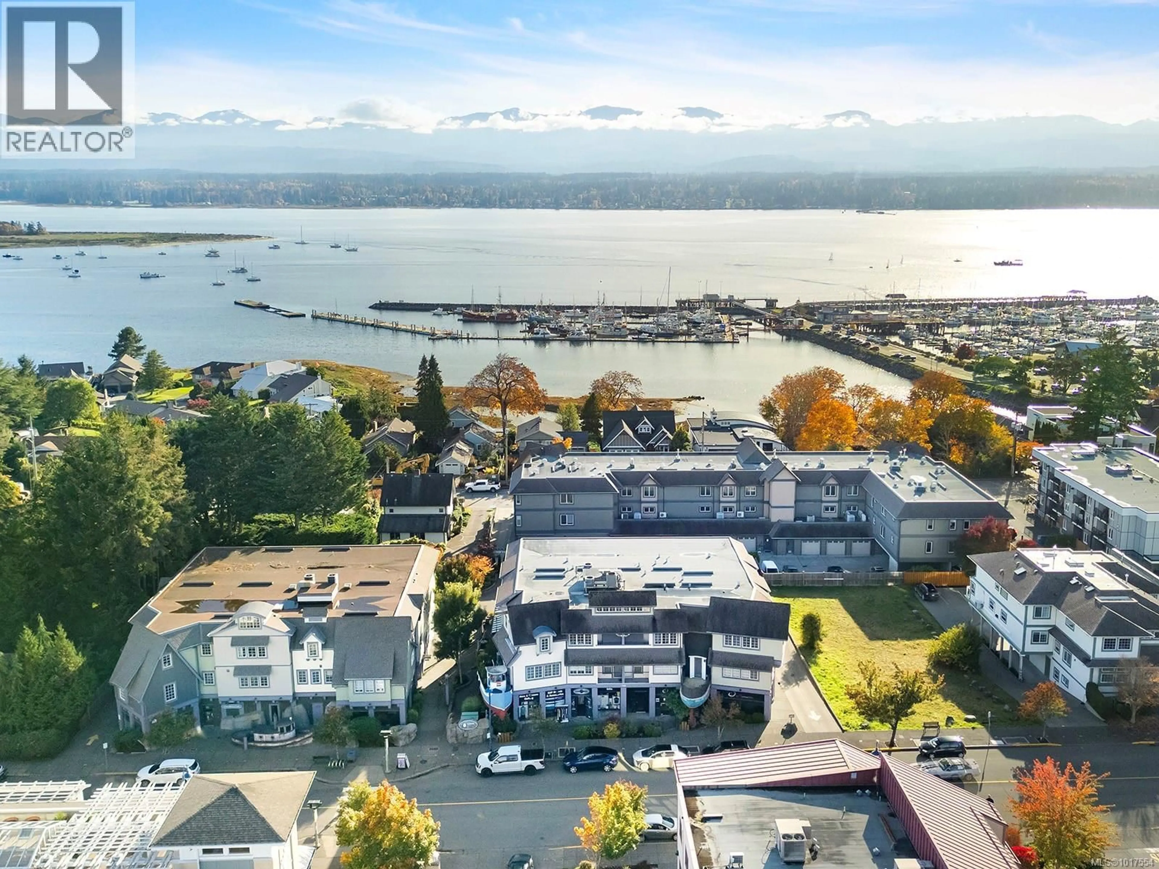 A pic from outside/outdoor area/front of a property/back of a property/a pic from drone, water/lake/river/ocean view for 203 - 1705 COMOX AVENUE, Comox British Columbia V9M3M1
