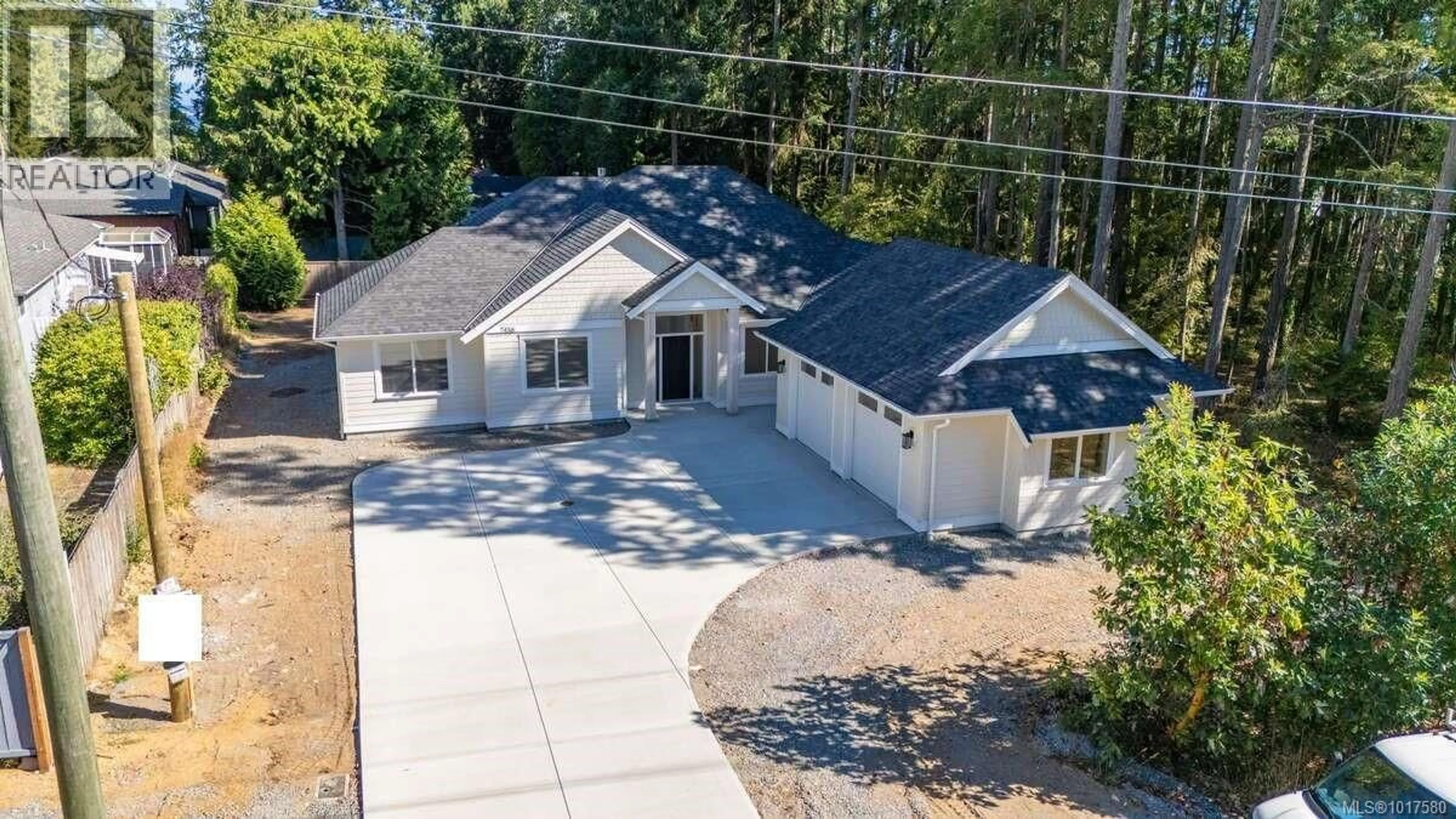 A pic from outside/outdoor area/front of a property/back of a property/a pic from drone, street for 7436 LANTZVILLE ROAD, Lantzville British Columbia V0R2H0