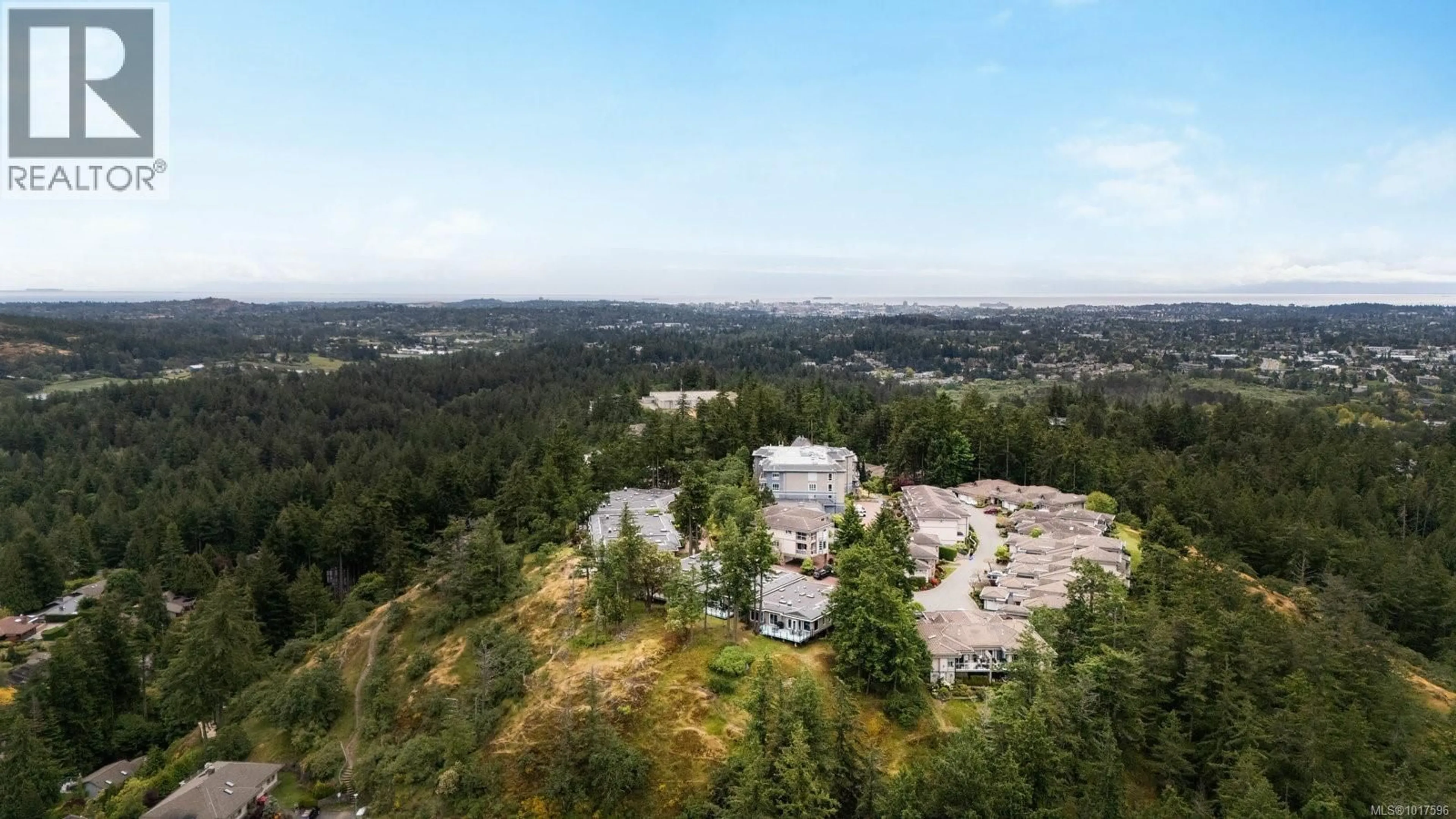 A pic from outside/outdoor area/front of a property/back of a property/a pic from drone, forest/trees view for 14 - 942 BOULDERWOOD RISE, Saanich British Columbia V8Y3H5