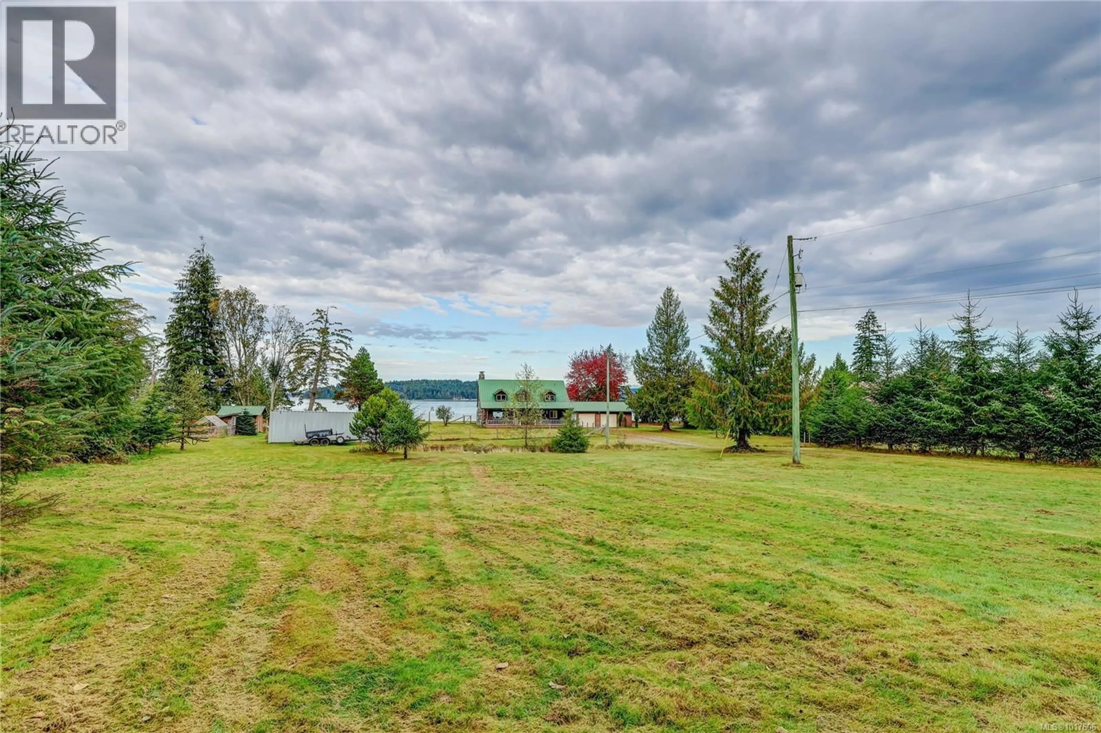 A pic from outside/outdoor area/front of a property/back of a property/a pic from drone, water/lake/river/ocean view for 6020 MINE ROAD, Port McNeill British Columbia V0N2R0