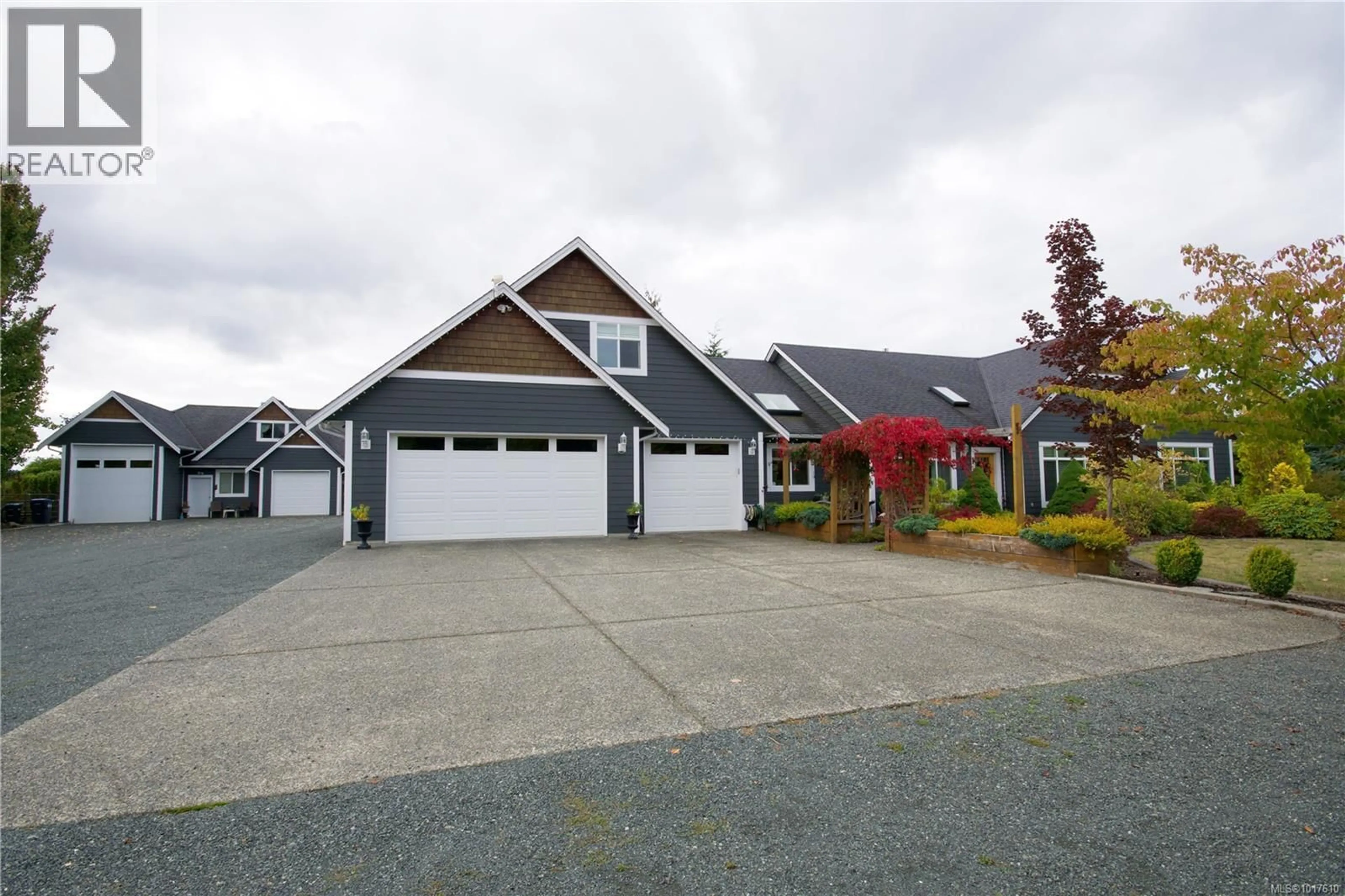Home with vinyl exterior material, street for 2040 SUN KING ROAD, Coombs British Columbia V0R1M0