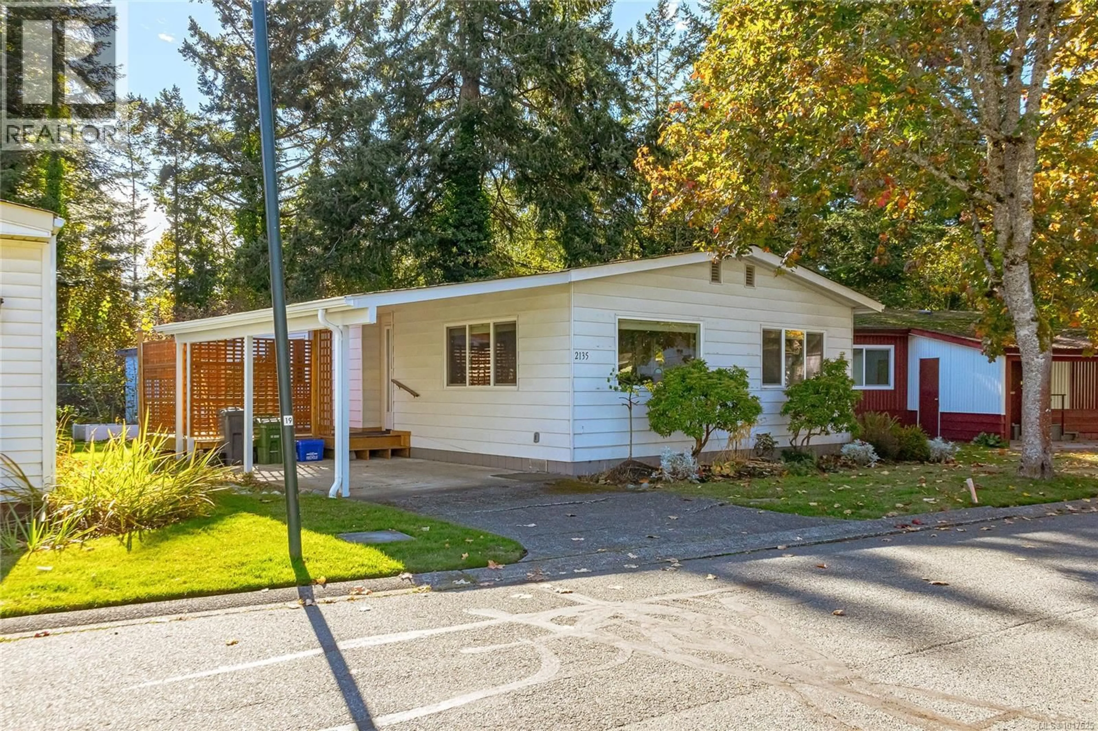 Home with vinyl exterior material, street for 2135 SUMMERGATE BOULEVARD, Sidney British Columbia V8L4K9