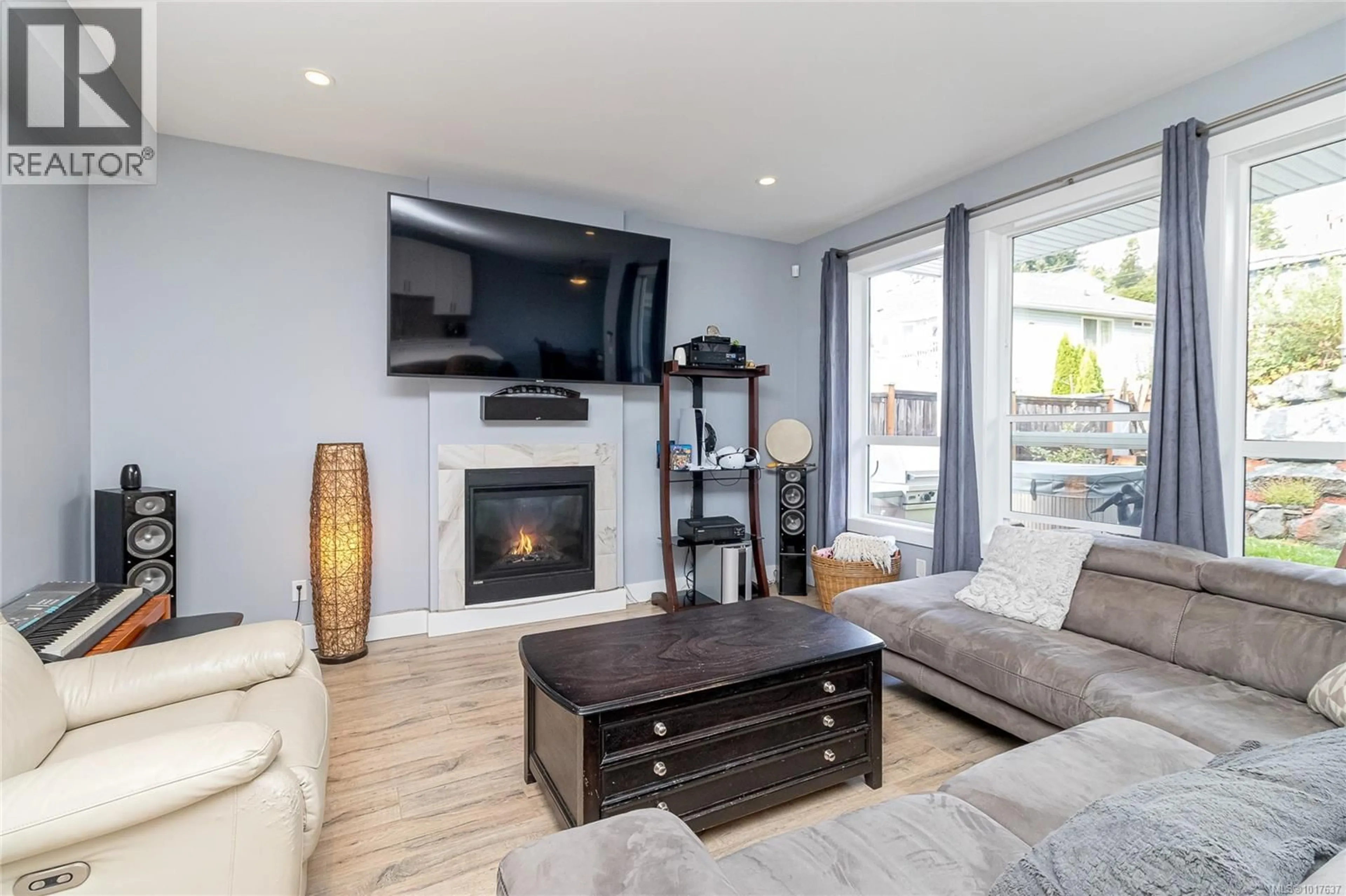 Living room with furniture, wood/laminate floor for 2178 WINFIELD DRIVE, Sooke British Columbia V9Z0N1