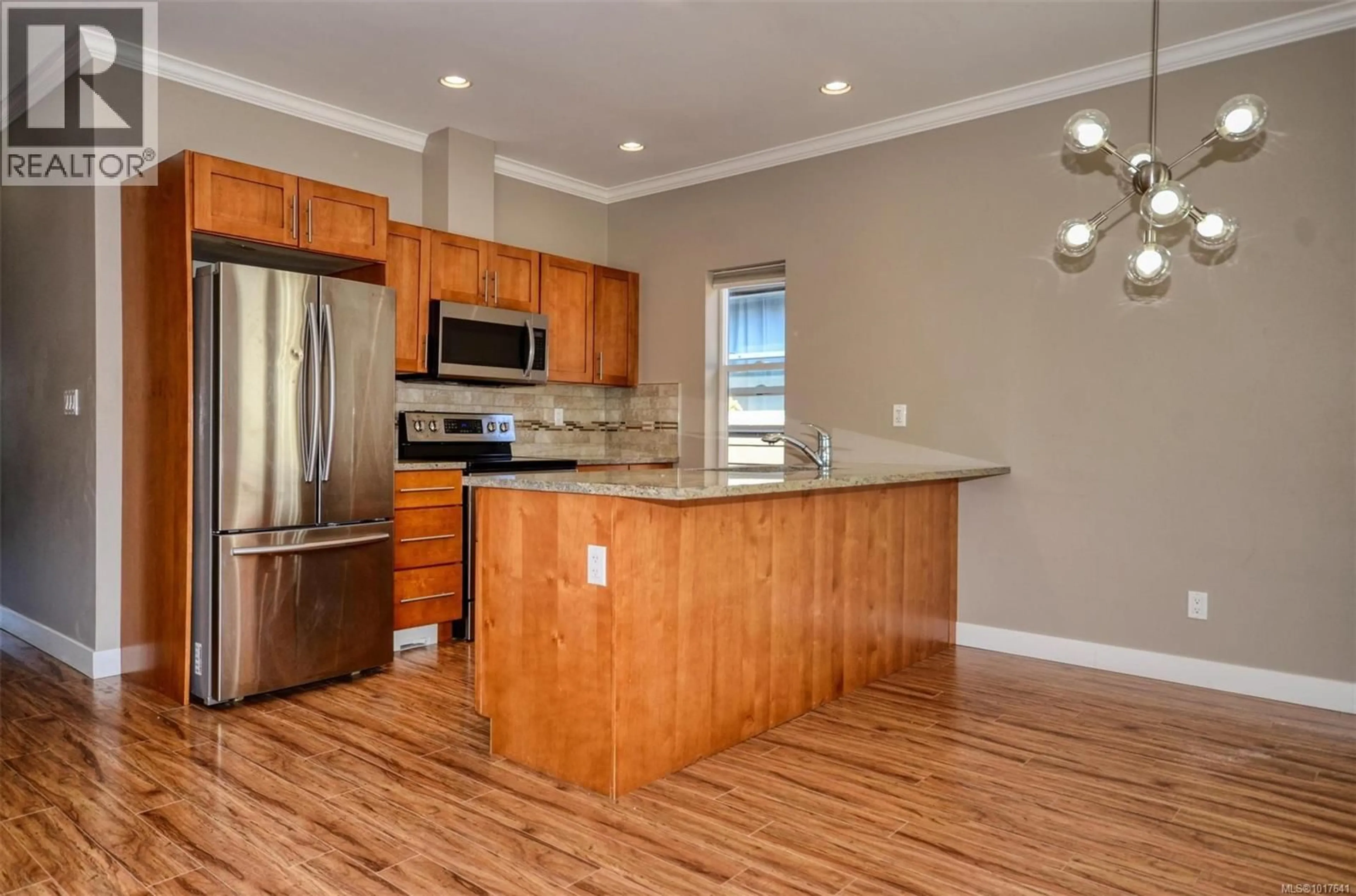 Open concept kitchen, wood/laminate floor for 3307 MERLIN ROAD, Langford British Columbia V9C0H3