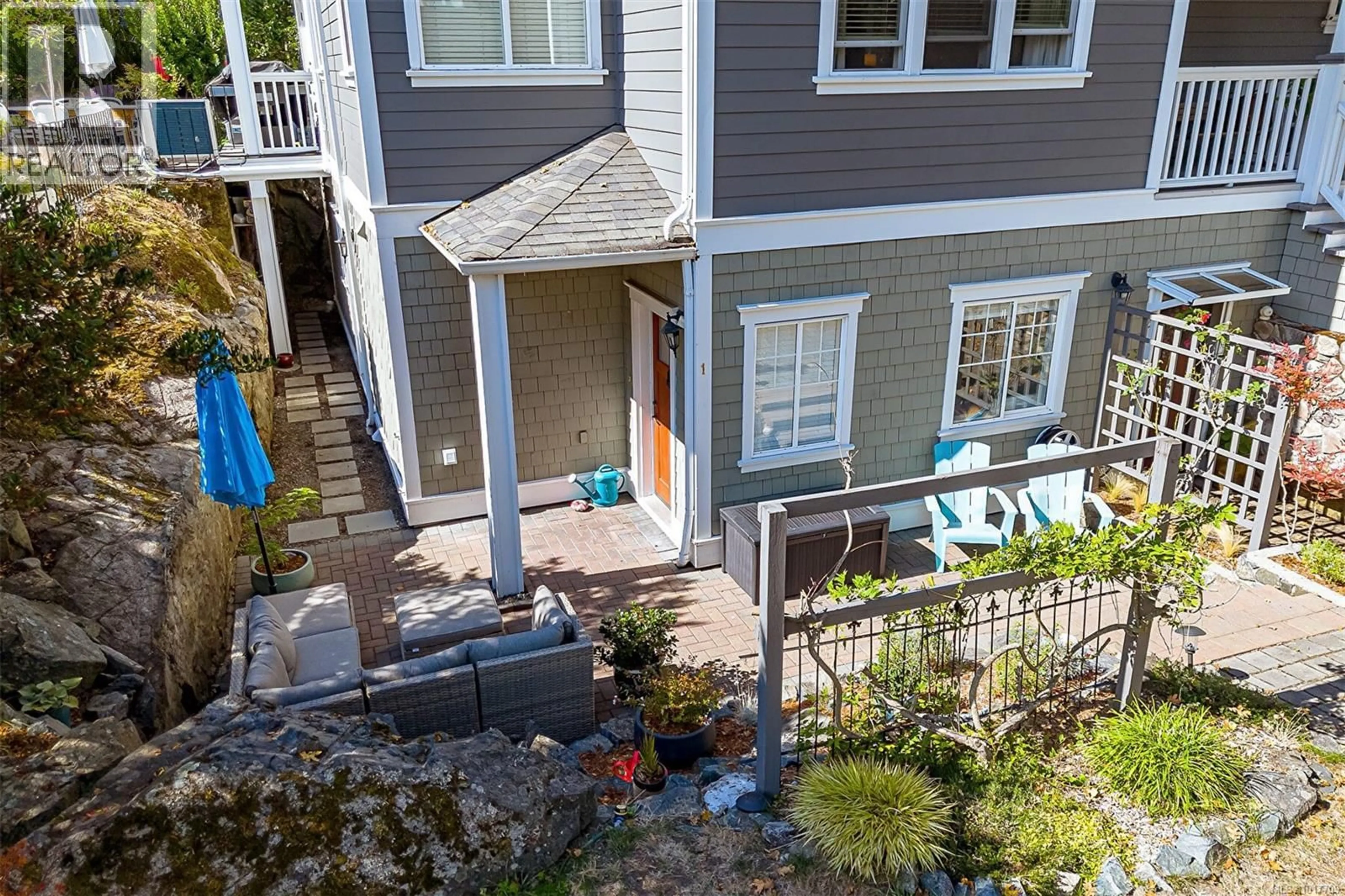 A pic from outside/outdoor area/front of a property/back of a property/a pic from drone, street for 1 - 1002 CARBERRY GARDENS, Victoria British Columbia V8S3R7