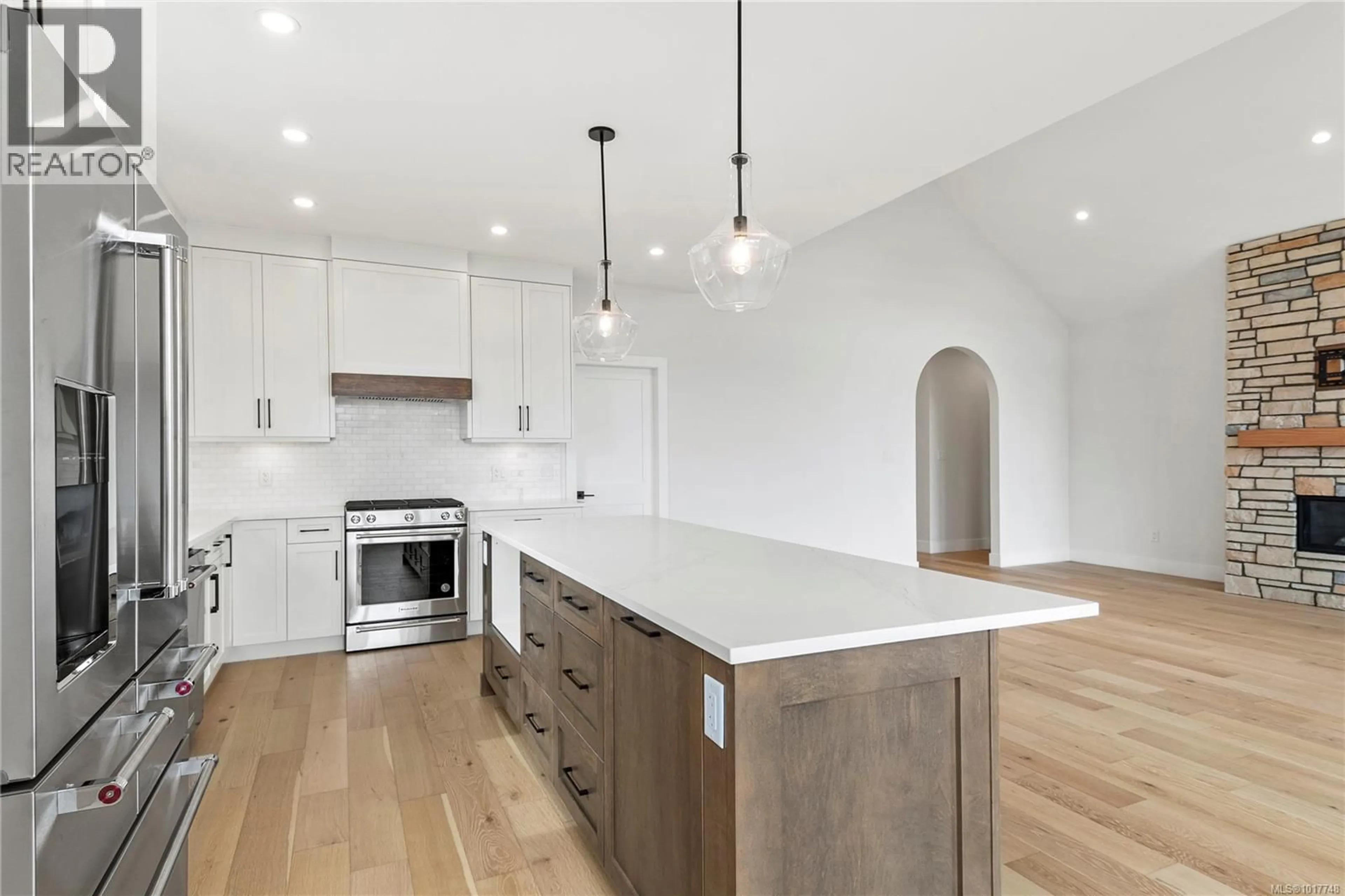 Open concept kitchen, wood/laminate floor for 3428 RHYS ROAD, Courtenay British Columbia V9N7G3