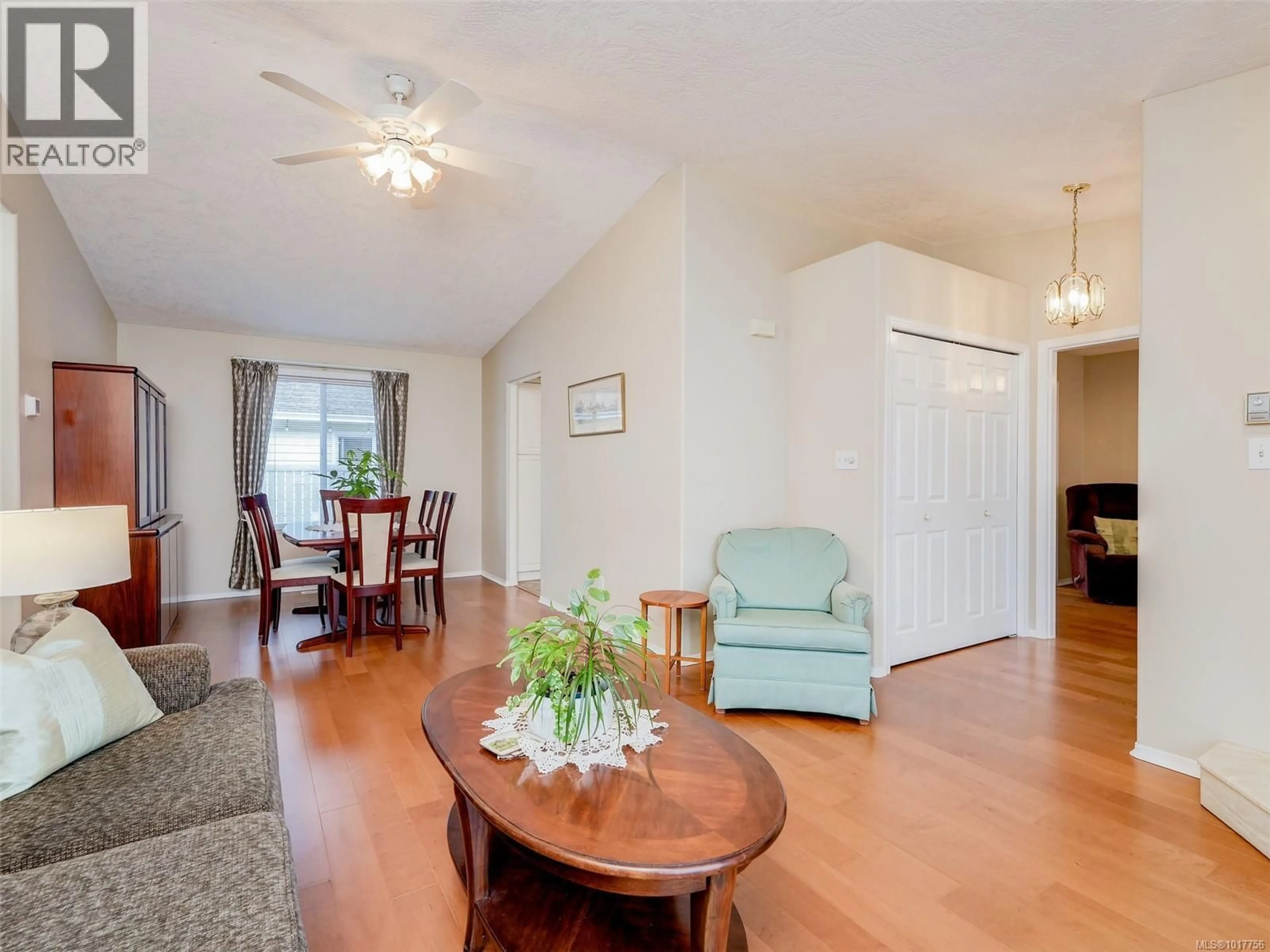 Living room with furniture, wood/laminate floor for 13 EAGLE LANE, View Royal British Columbia V9A7M2