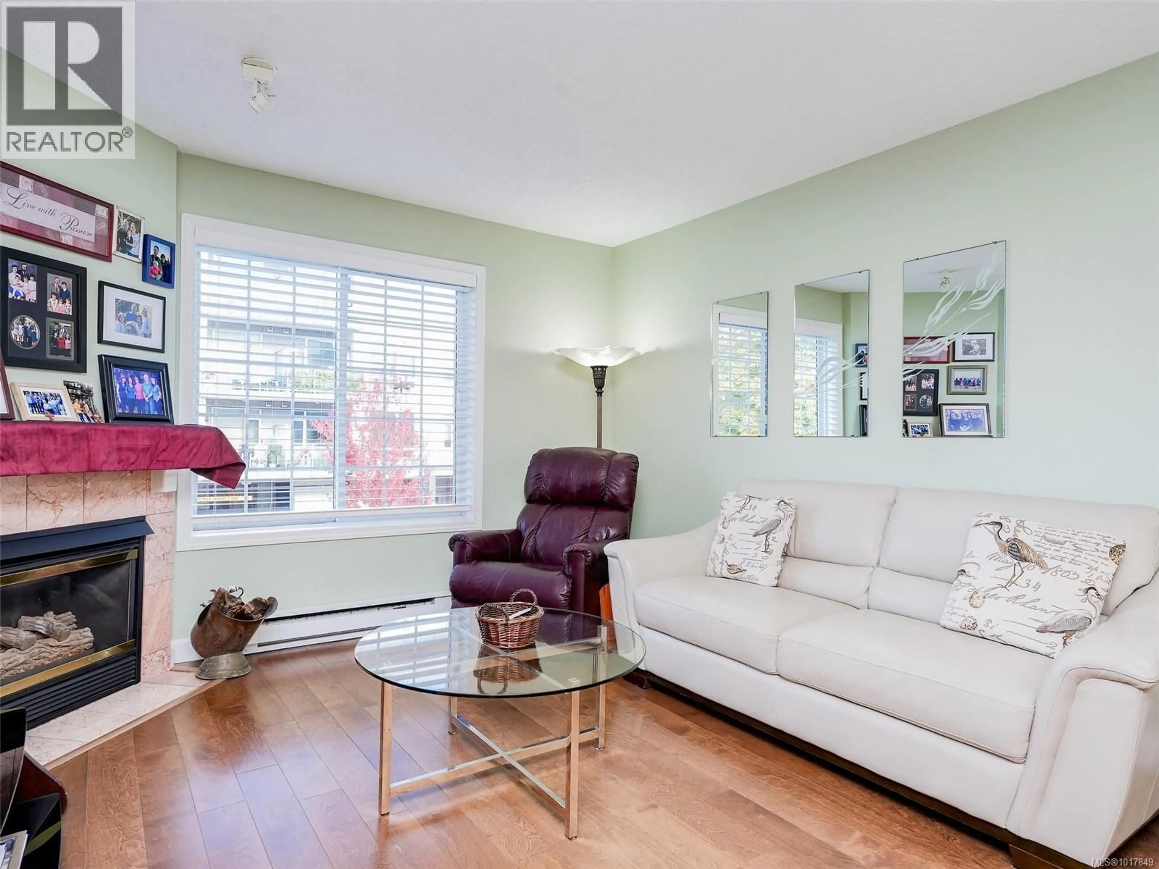 Living room with furniture, wood/laminate floor for 201 - 2421 SIDNEY AVENUE, Sidney British Columbia V8L1Y8
