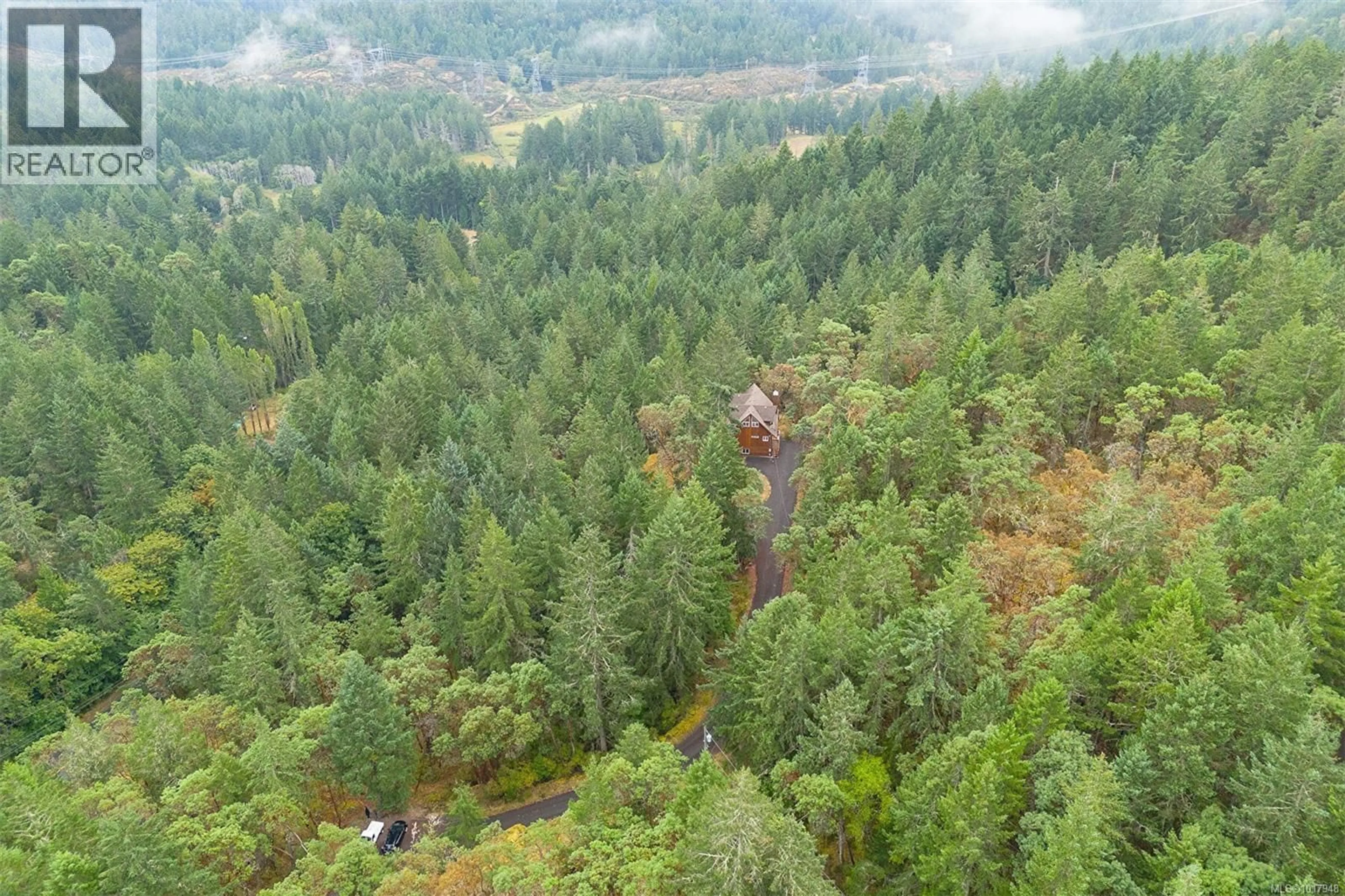 A pic from outside/outdoor area/front of a property/back of a property/a pic from drone, forest/trees view for 3715 MUNN ROAD, Highlands British Columbia V9E1C8