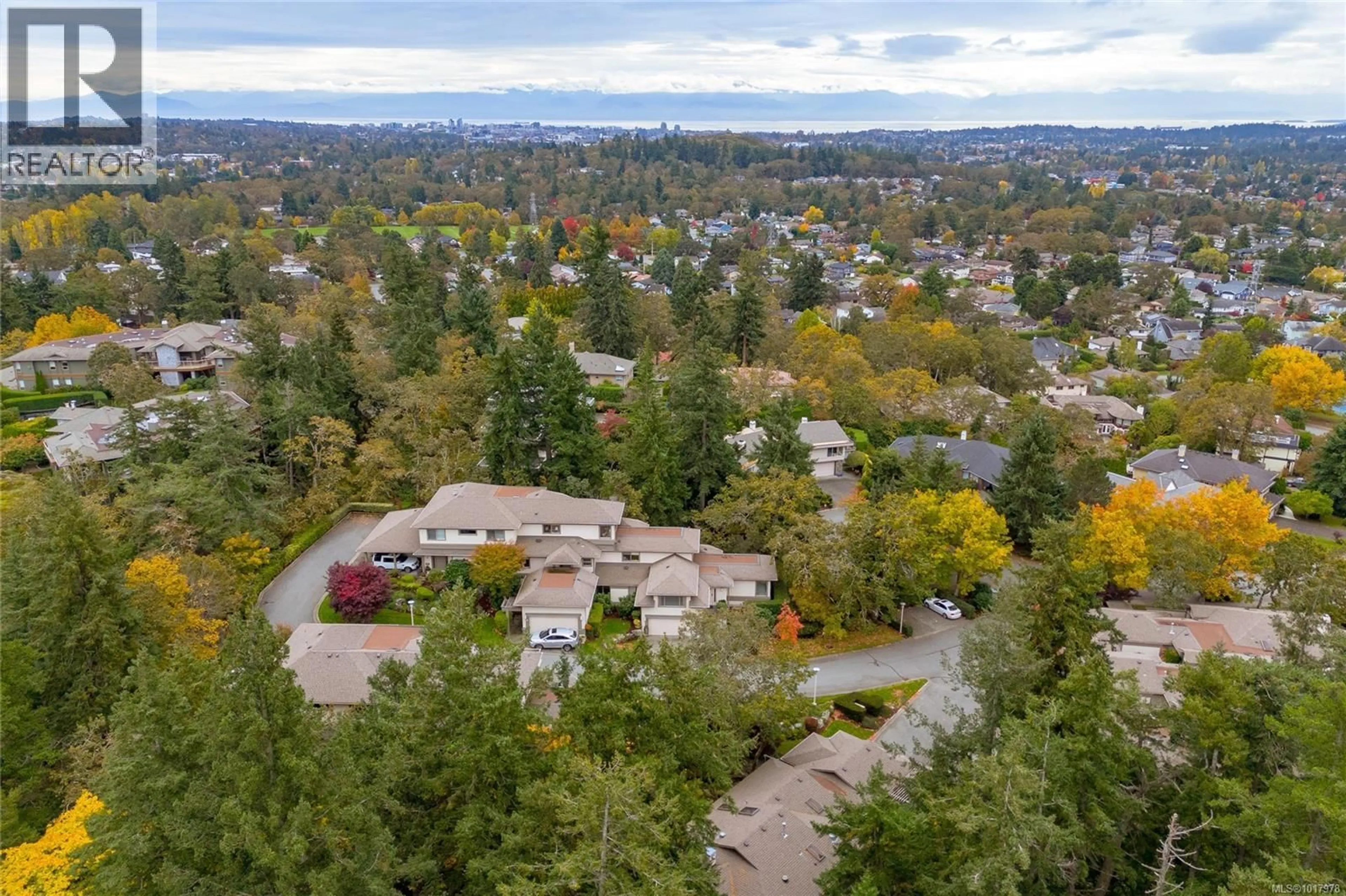 A pic from outside/outdoor area/front of a property/back of a property/a pic from drone, forest/trees view for 47 - 4300 STONEYWOOD LANE, Saanich British Columbia V8X5A5