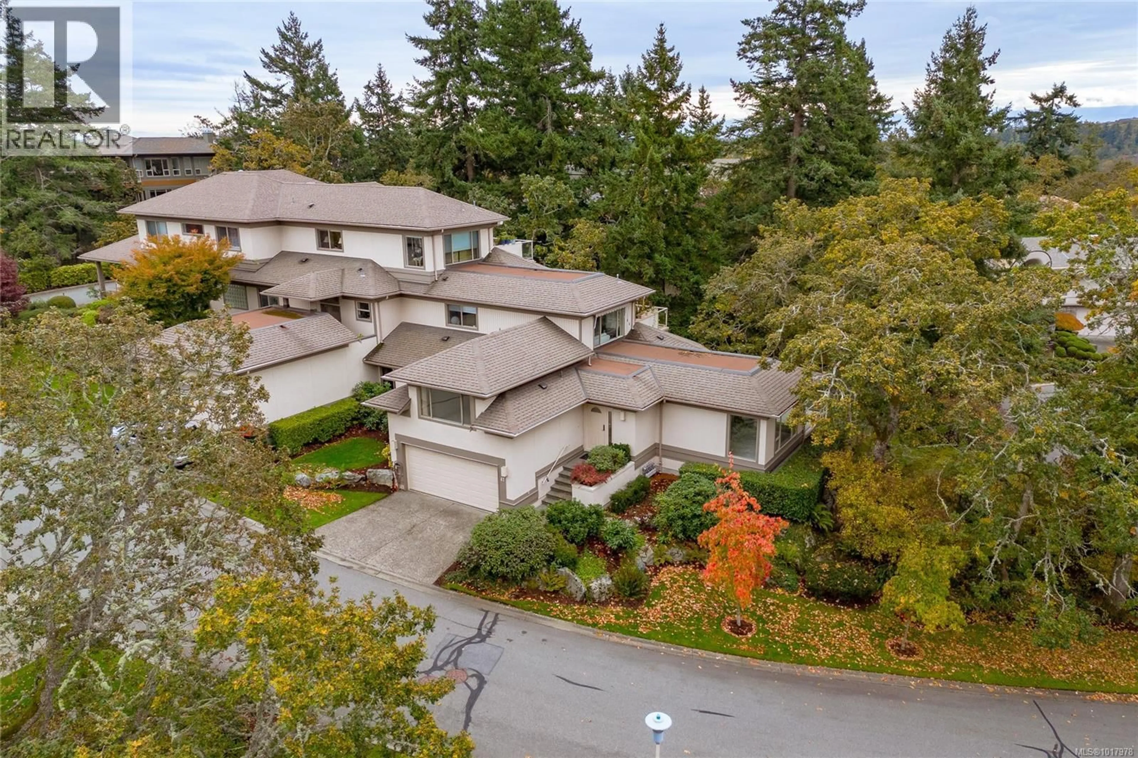 A pic from outside/outdoor area/front of a property/back of a property/a pic from drone, street for 47 - 4300 STONEYWOOD LANE, Saanich British Columbia V8X5A5