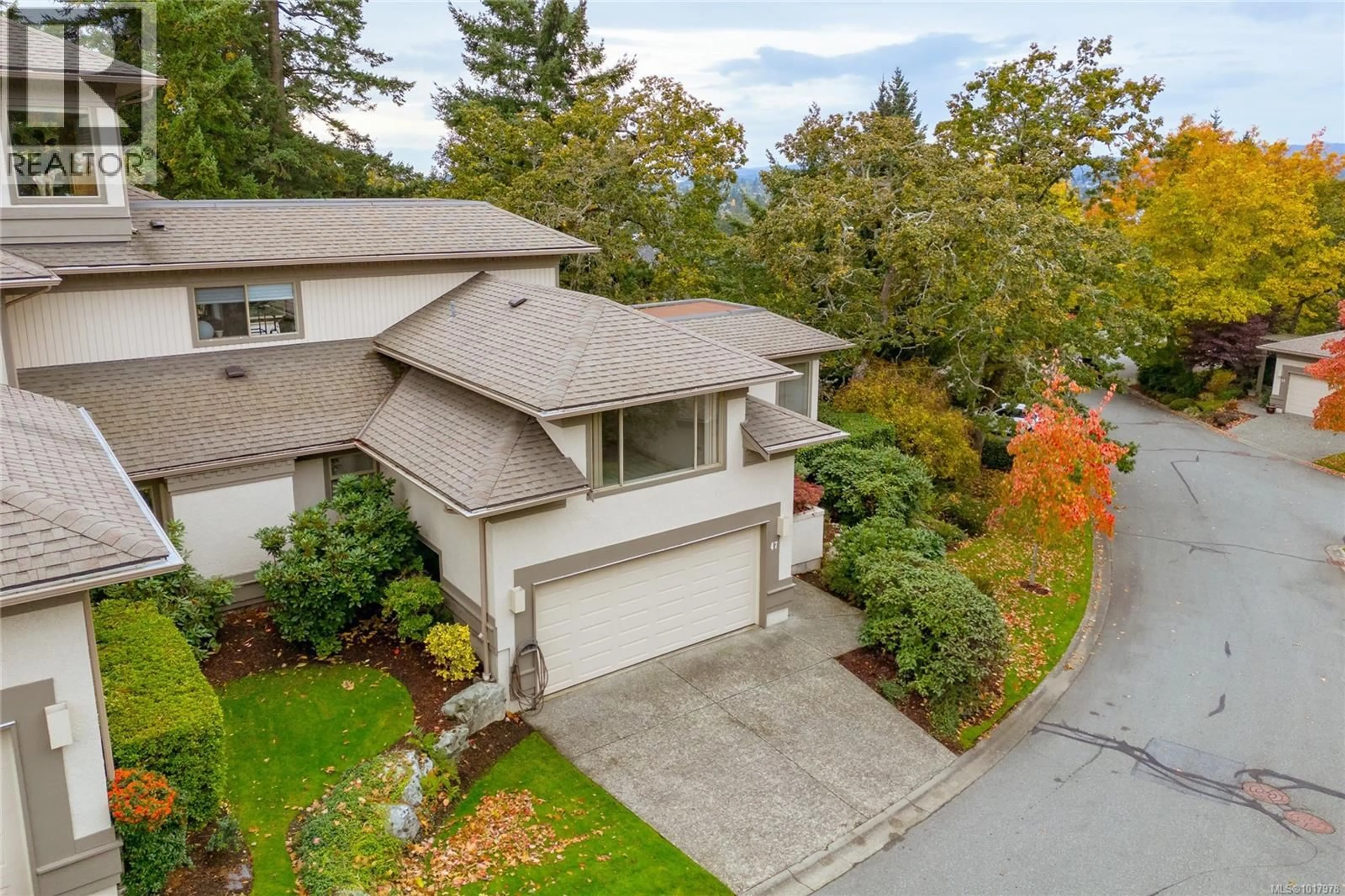 A pic from outside/outdoor area/front of a property/back of a property/a pic from drone, street for 47 - 4300 STONEYWOOD LANE, Saanich British Columbia V8X5A5