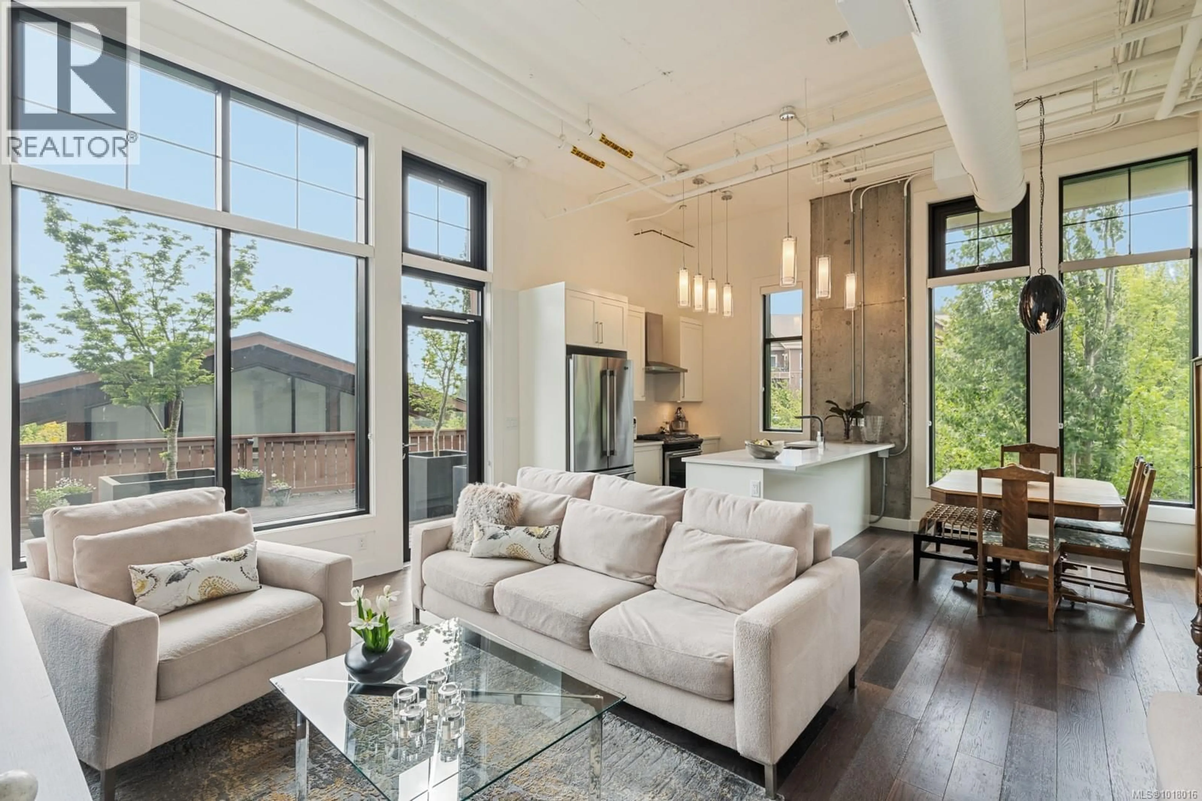 Living room with furniture, unknown for 201 - 2049 COUNTRY CLUB WAY, Langford British Columbia V9B0H8