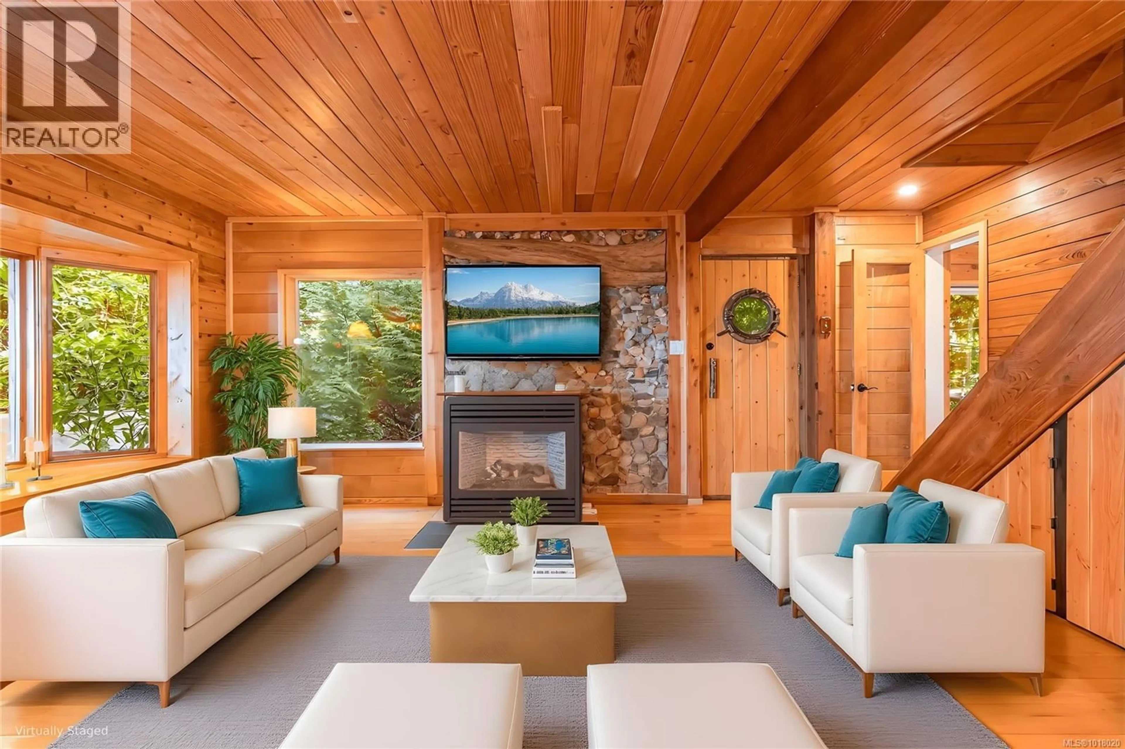 Living room with furniture, wood/laminate floor for 235 SPEARFISH ROAD, Qualicum Beach British Columbia V9K2A6