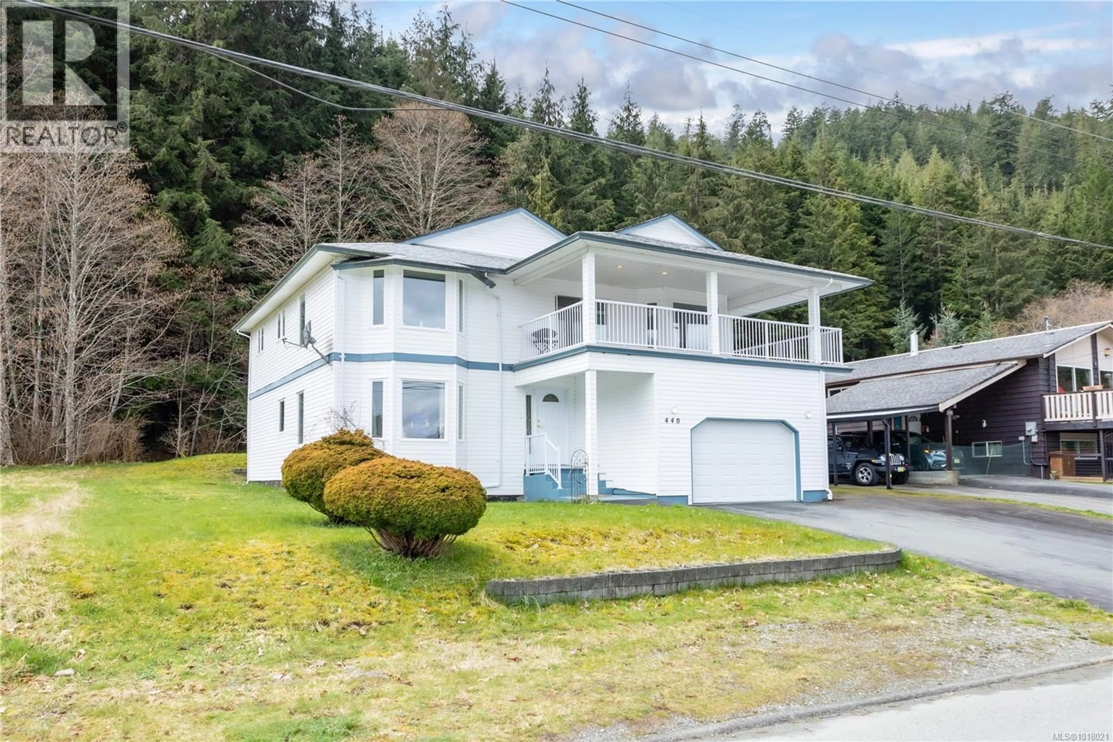 Home with vinyl exterior material, street for 440 MACMILLAN DRIVE, Sayward British Columbia V0P1R0