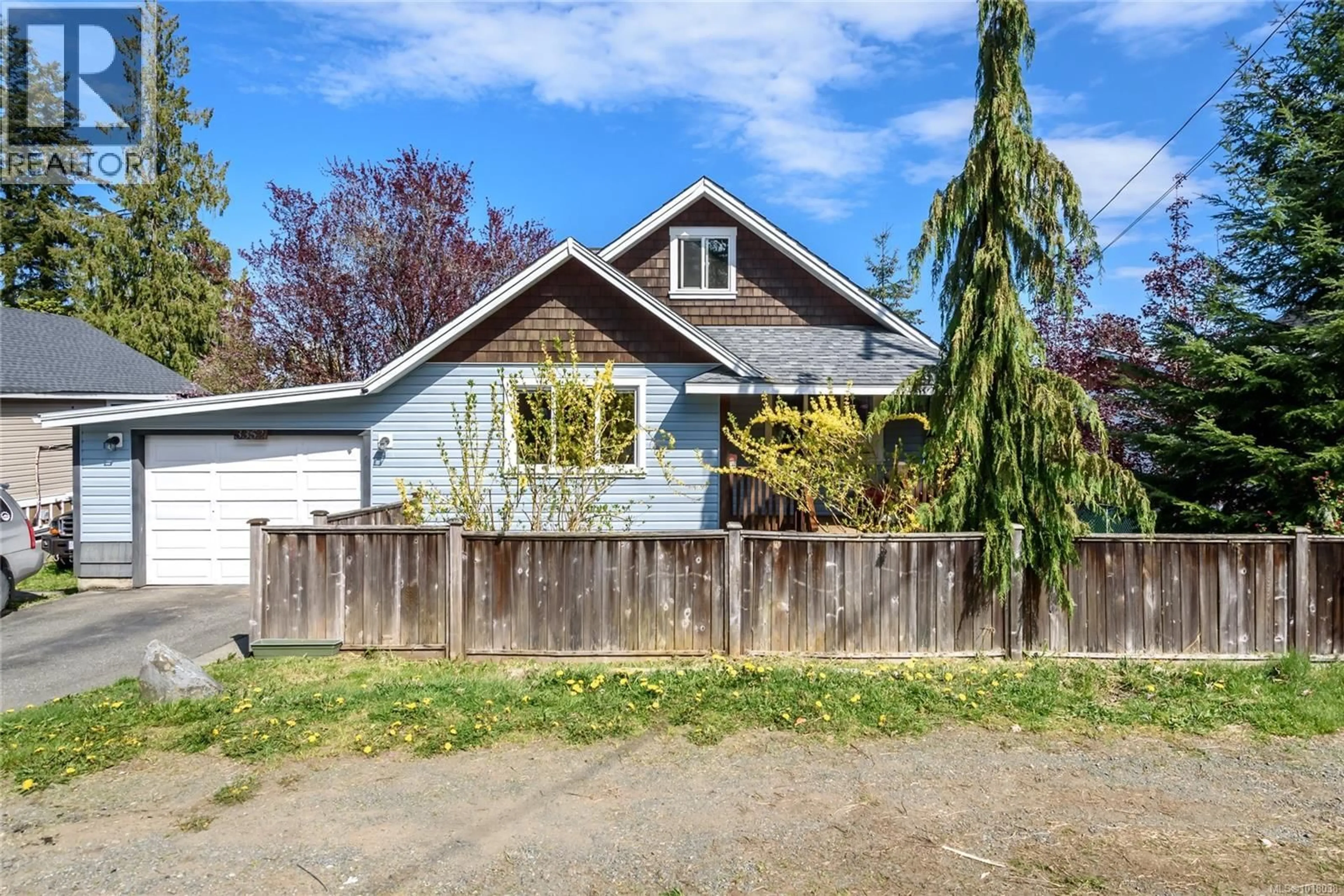 Home with vinyl exterior material, street for 3352 SECOND STREET, Cumberland British Columbia V0R1S0