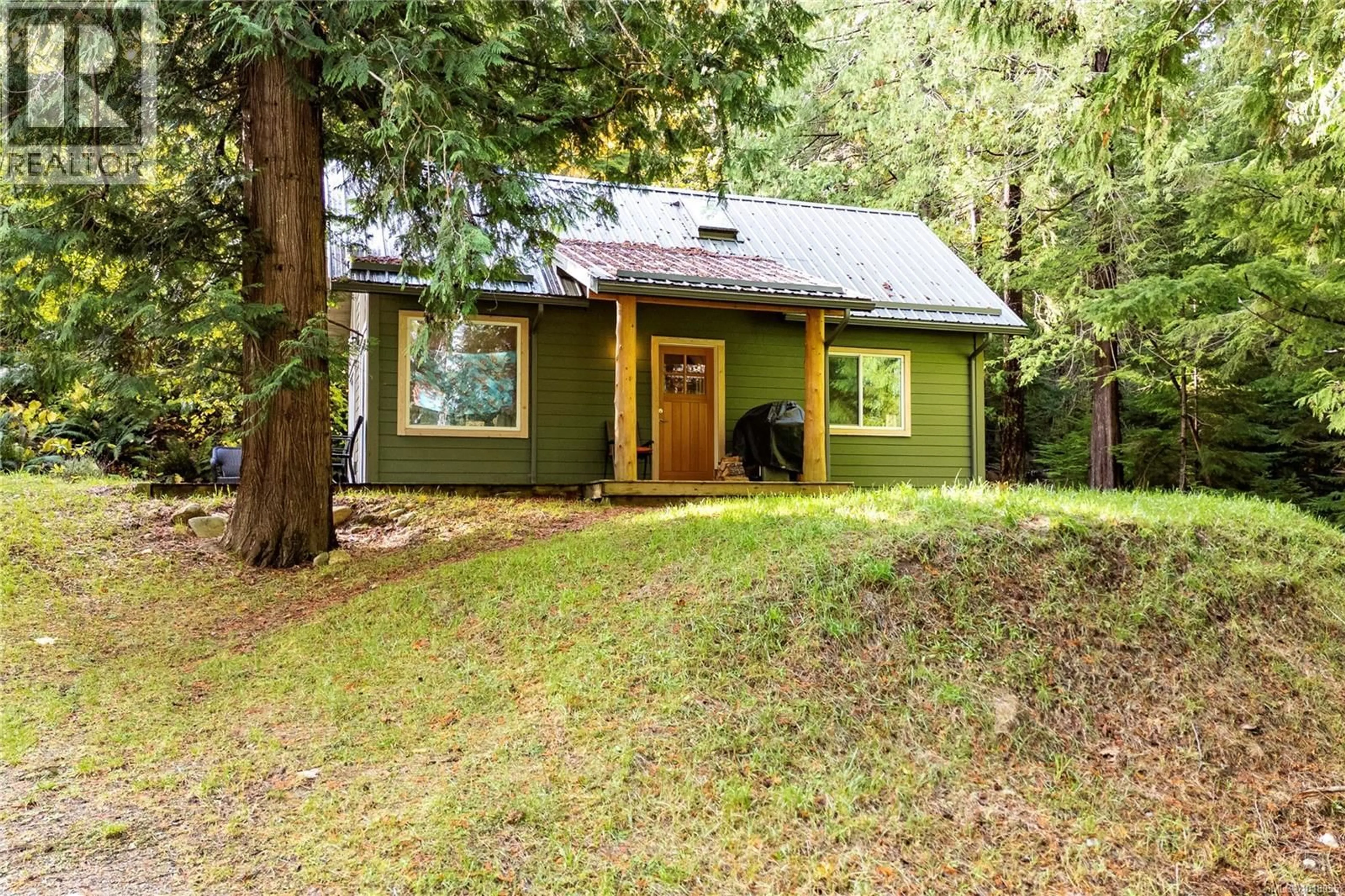 Home with vinyl exterior material, forest/trees view for 403 WHALETOWN ROAD, Cortes Island British Columbia V0P1Z0