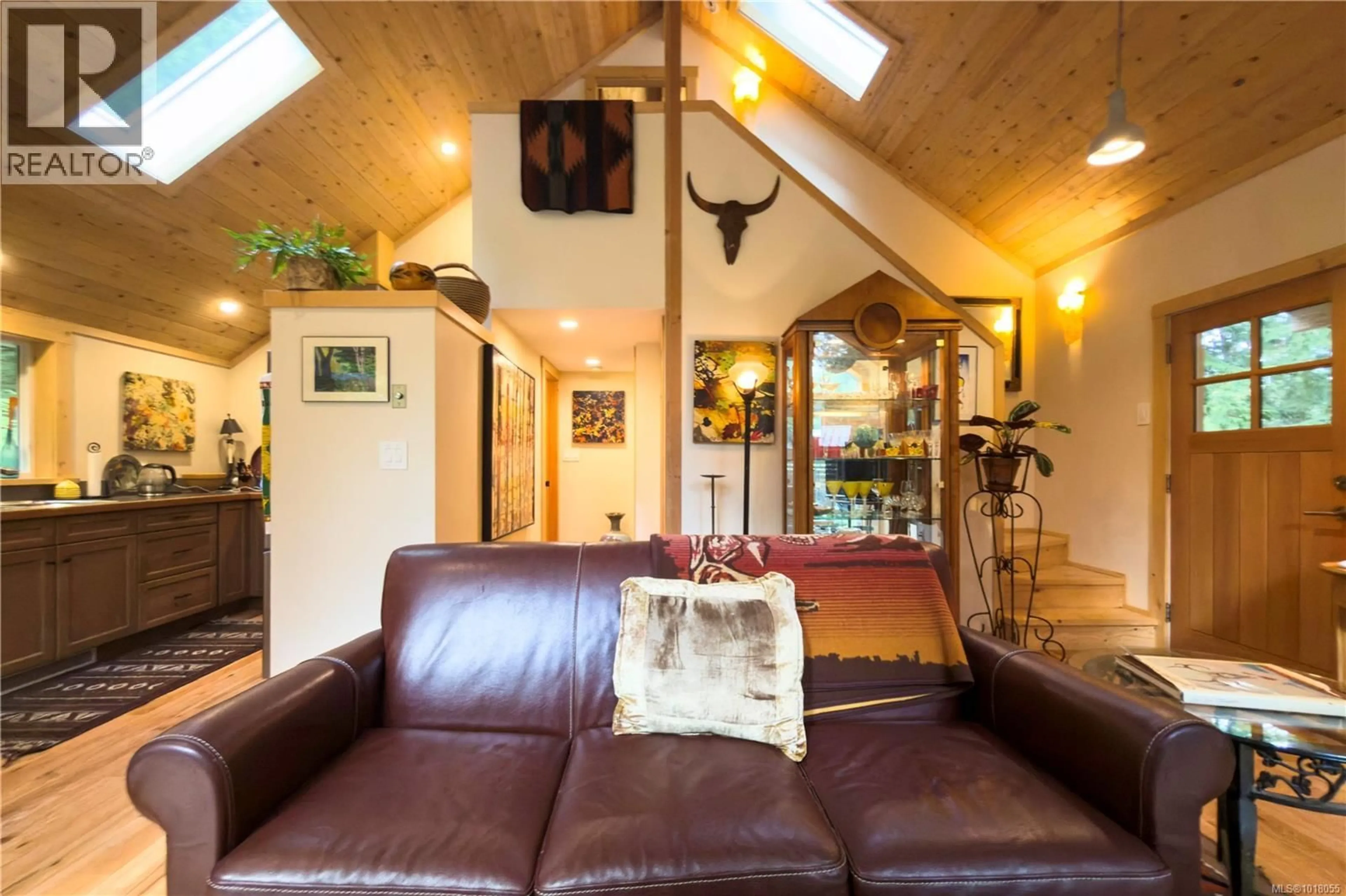 Living room with furniture, wood/laminate floor for 403 WHALETOWN ROAD, Cortes Island British Columbia V0P1Z0
