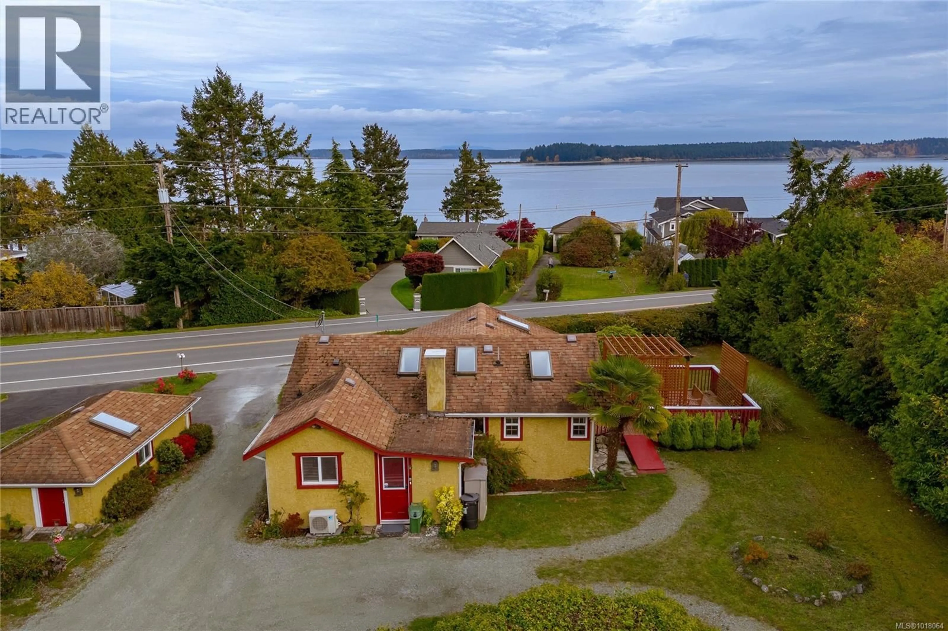 A pic from outside/outdoor area/front of a property/back of a property/a pic from drone, water/lake/river/ocean view for 8576 LOCHSIDE DRIVE, North Saanich British Columbia V8L1M6