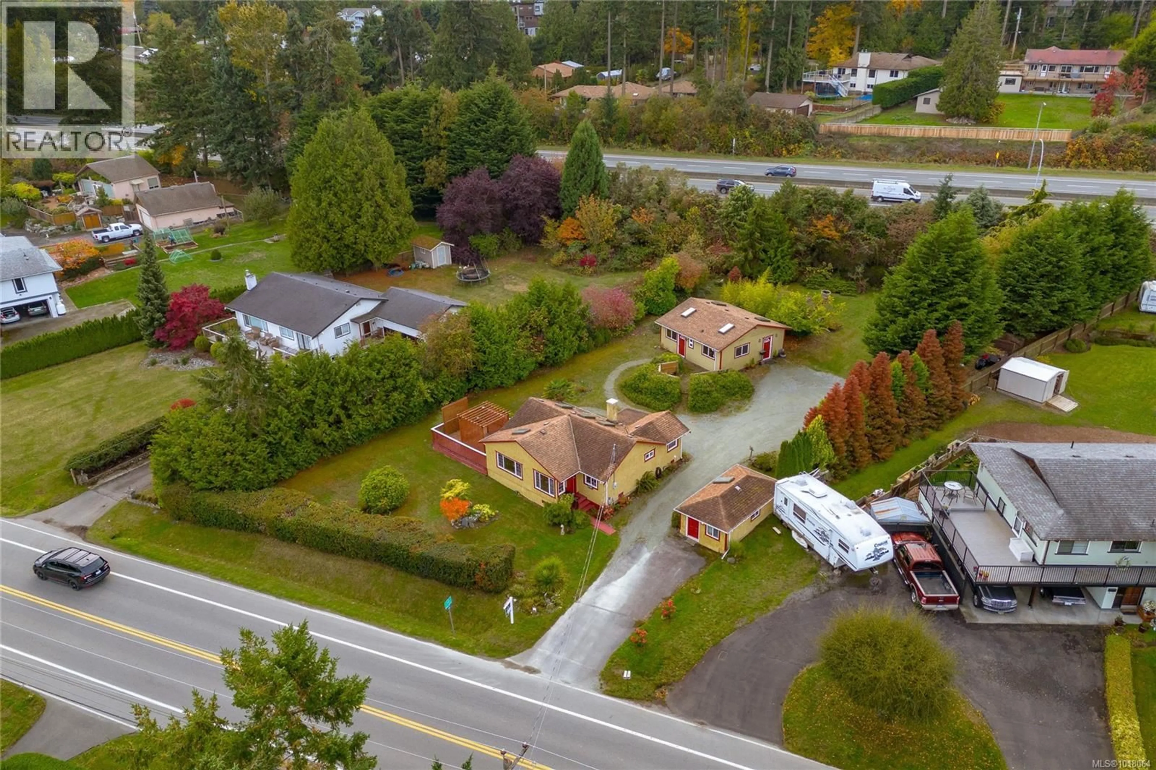 A pic from outside/outdoor area/front of a property/back of a property/a pic from drone, street for 8576 LOCHSIDE DRIVE, North Saanich British Columbia V8L1M6