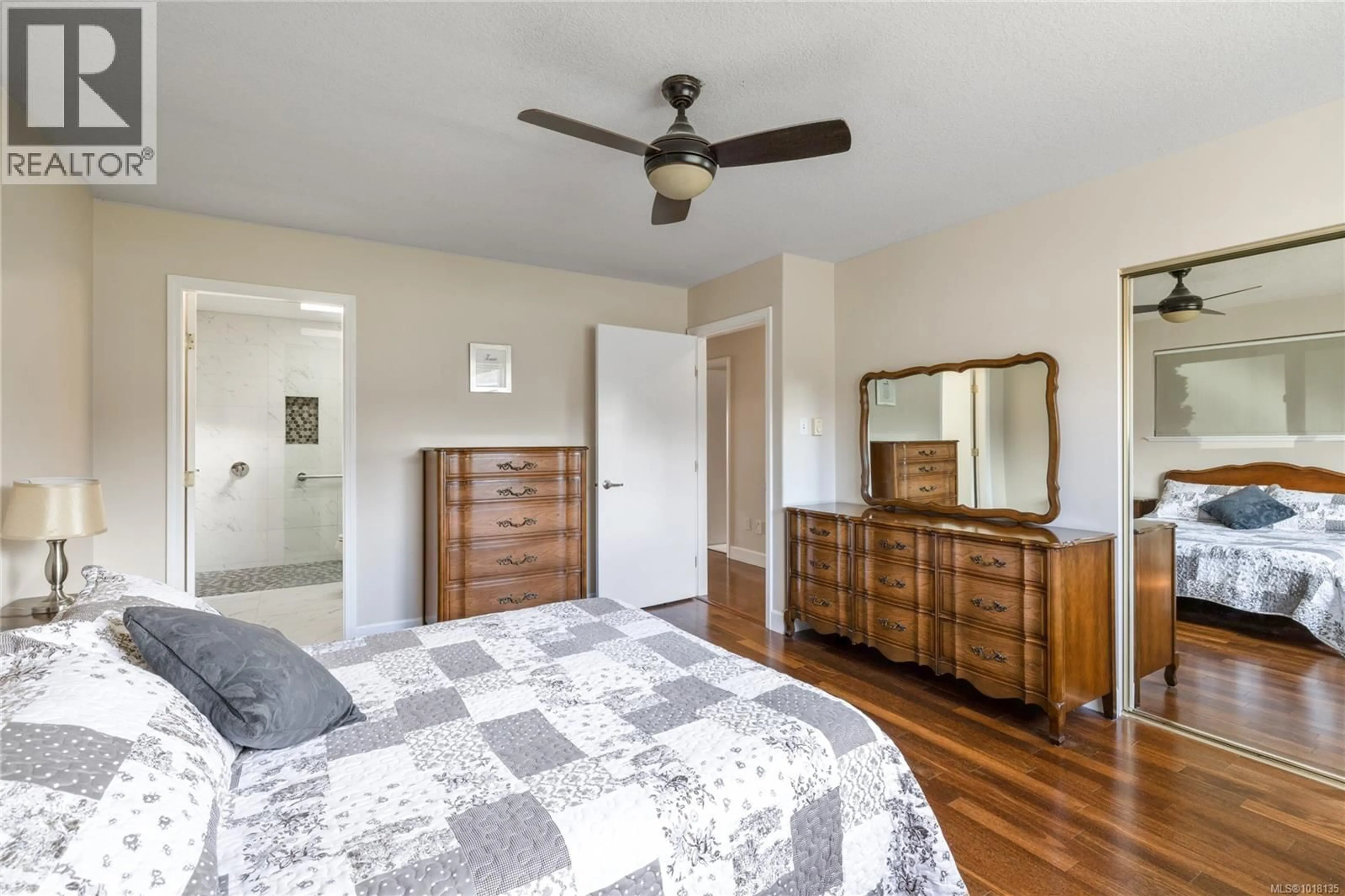 Bedroom with bed, wood/laminate floor for 3021 RAYMUR PLACE, Qualicum Beach British Columbia V9K2N9