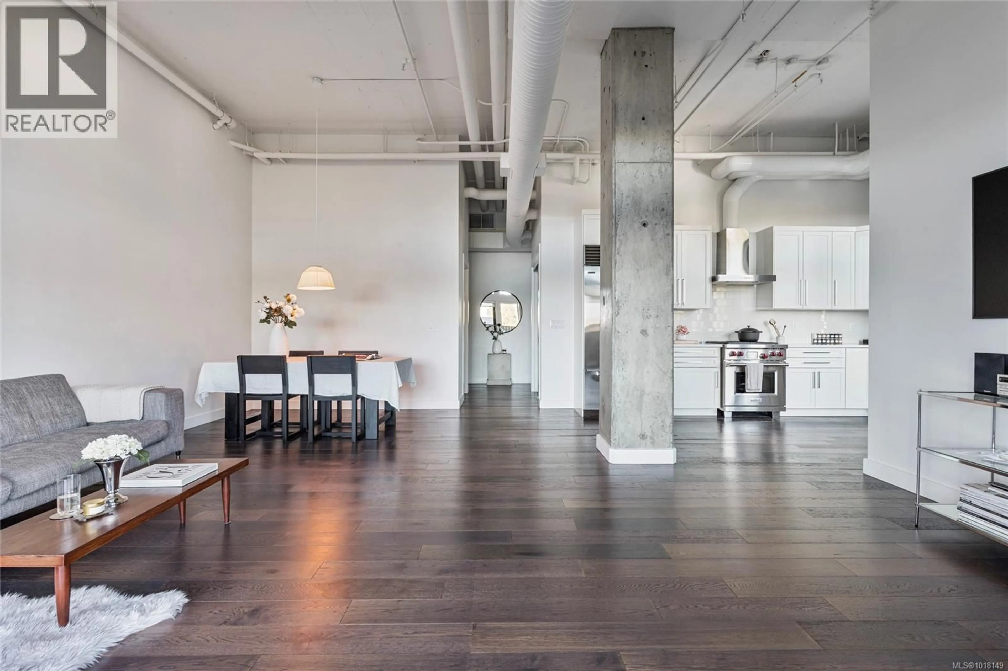 Open concept kitchen, cement floor for 205 - 2049 COUNTRY CLUB WAY, Langford British Columbia V9B0H8