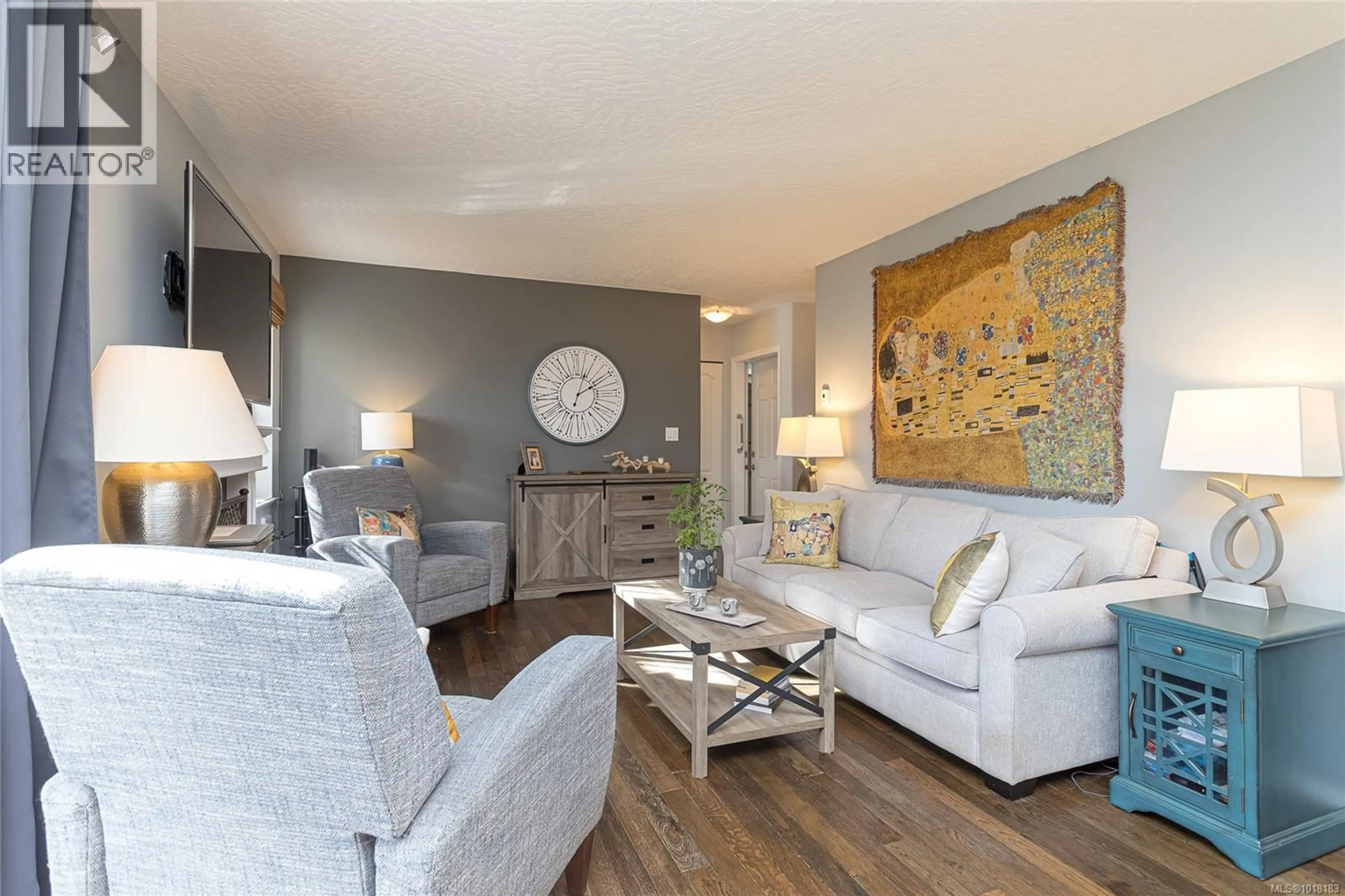 Living room with furniture, wood/laminate floor for 1752 COUNTRY ROAD, Qualicum Beach British Columbia V9K2S3