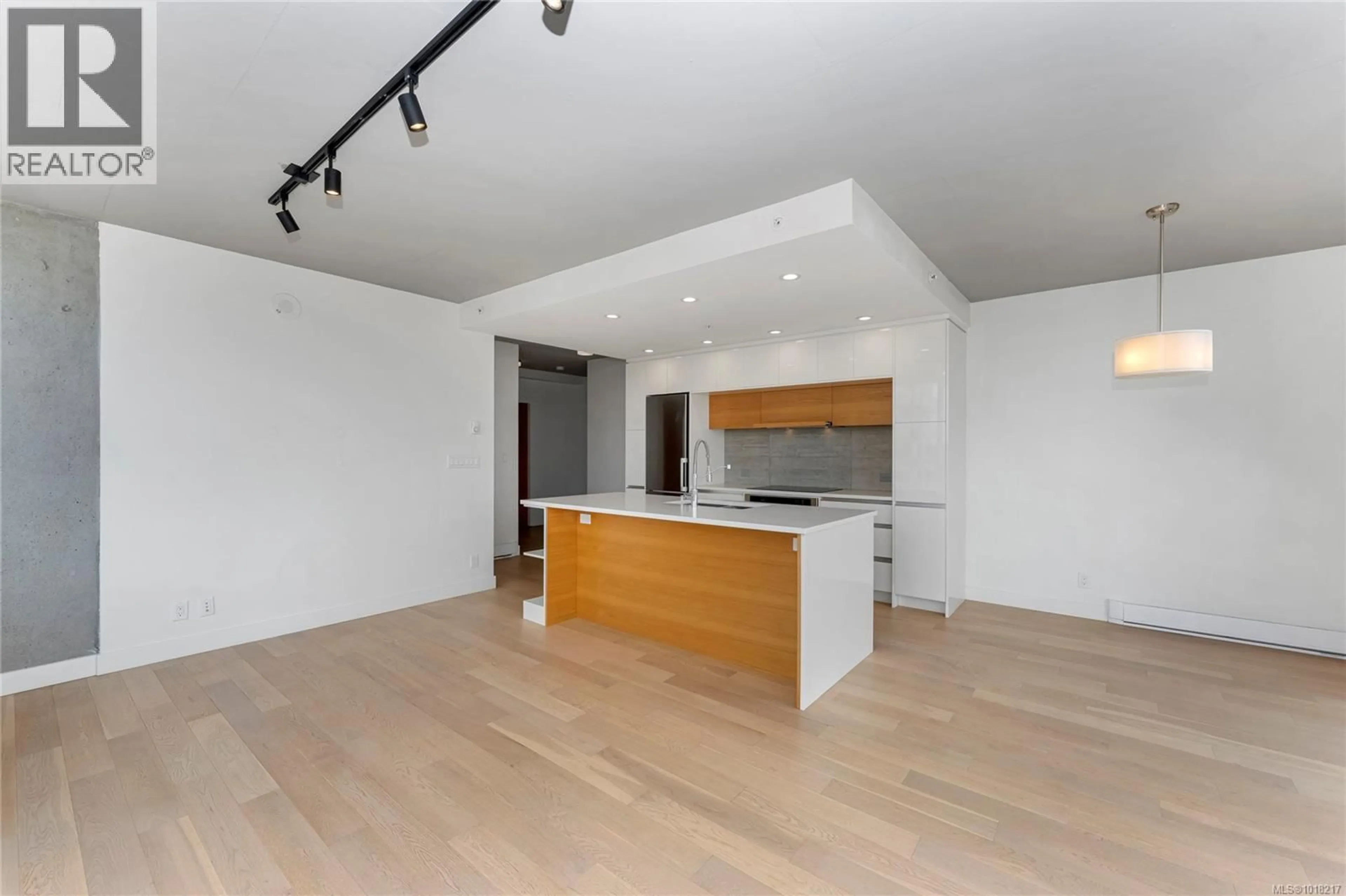 Open concept kitchen, wood/laminate floor for 804 - 989 JOHNSON STREET, Victoria British Columbia V8V0E3