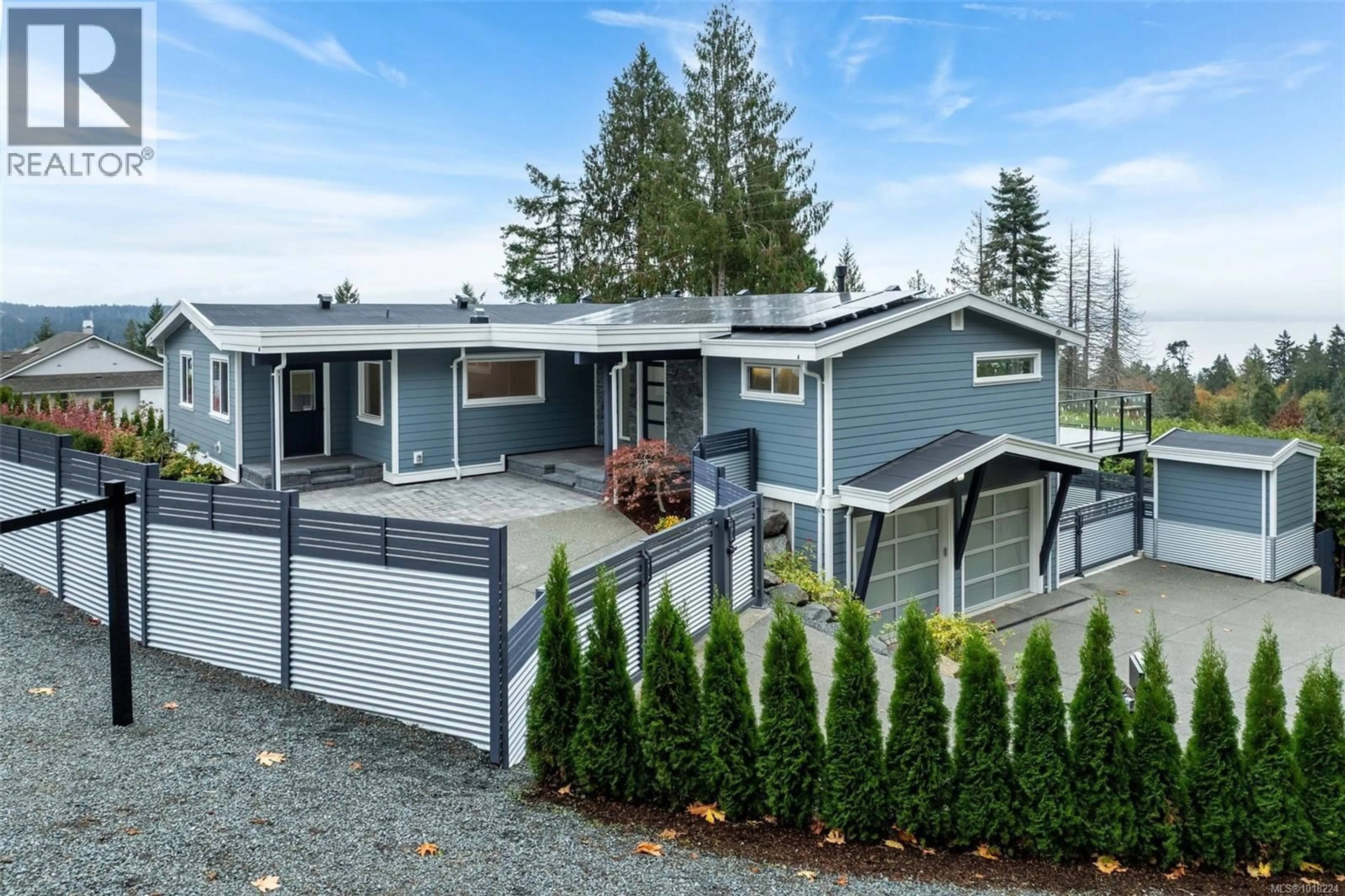 Home with vinyl exterior material, street for 667 NOOWICK ROAD, Mill Bay British Columbia V8H1G5