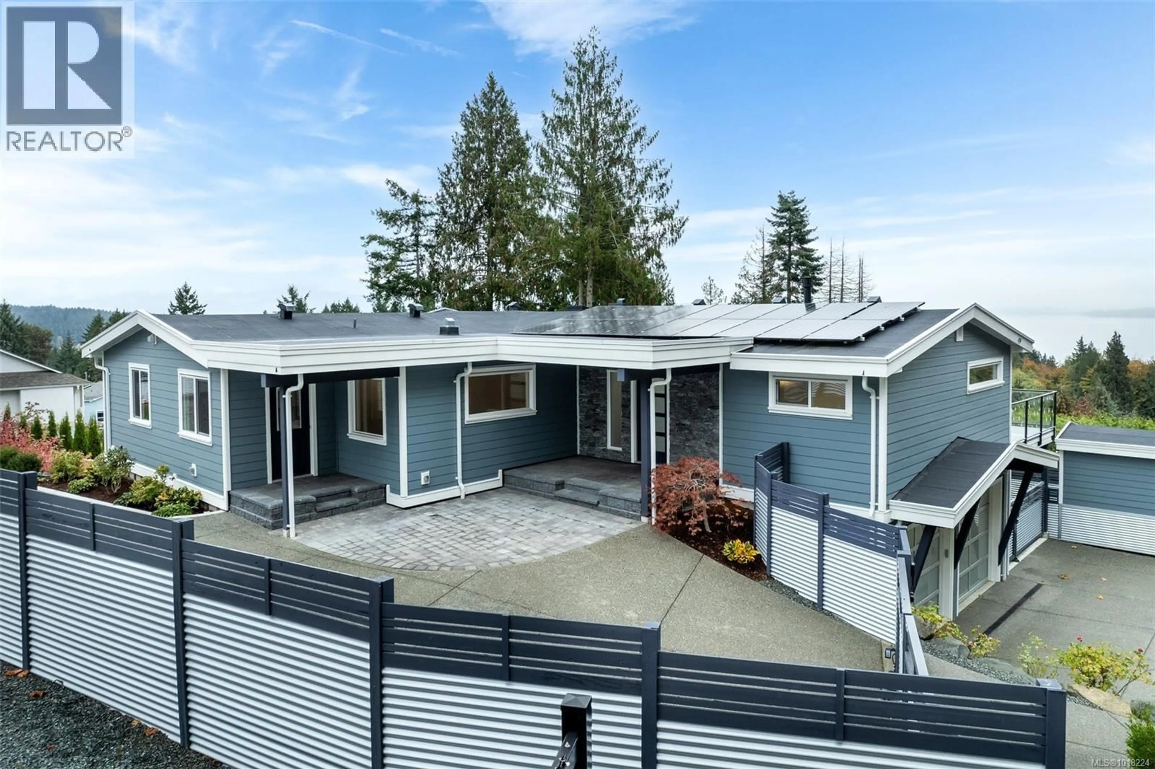 Home with vinyl exterior material, street for 667 NOOWICK ROAD, Mill Bay British Columbia V8H1G5